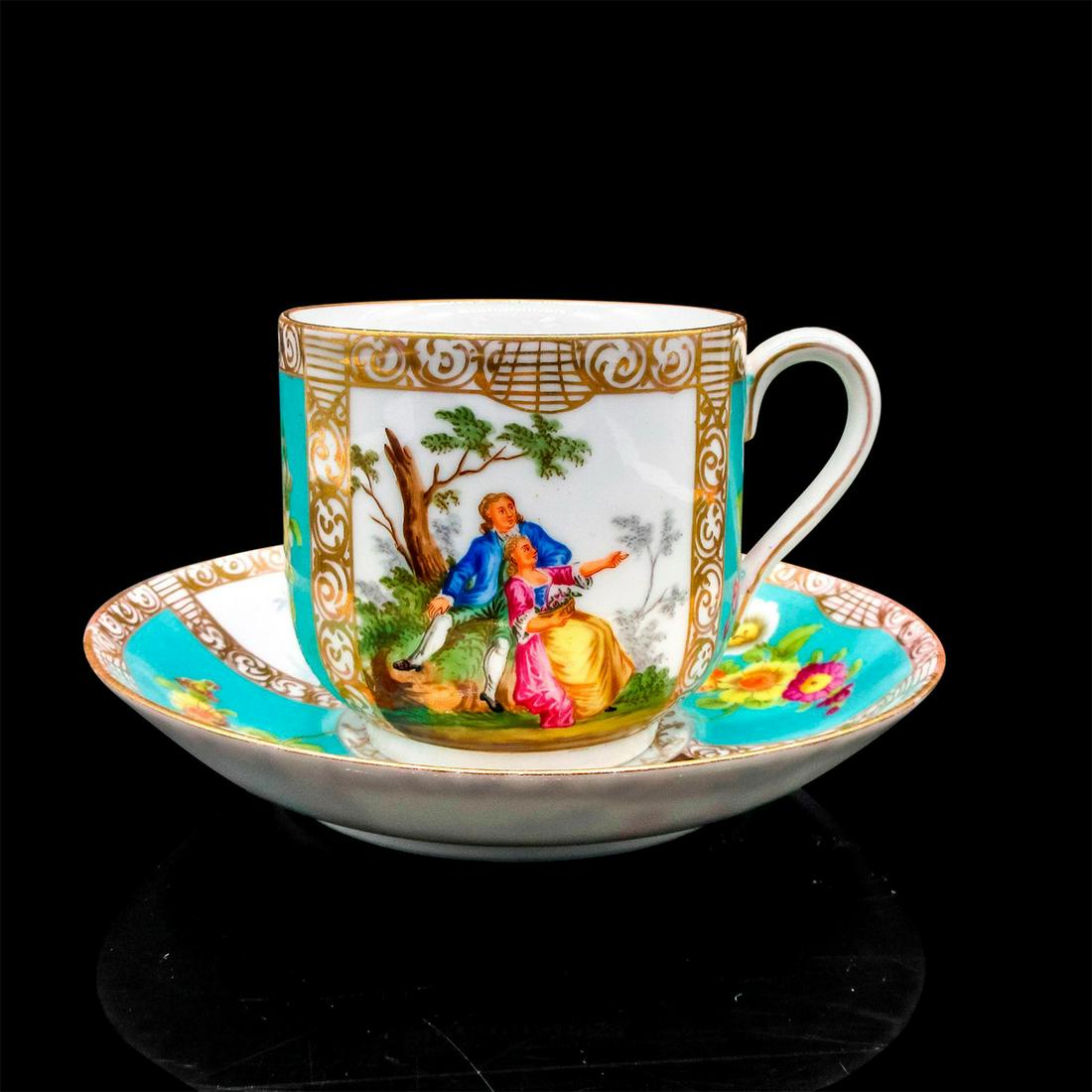 Vintage Mustache Tea Cup and Saucer: Elegant set with painted scenes of couples, flowers and gold scroll design and rim. Moustache partition to protect moustache from beverage. Cup size - 3.125"H x 3.5" diameter. Saucer size - 6.
