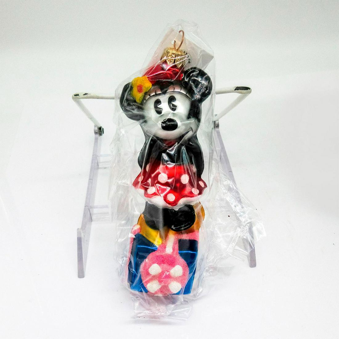 Christopher Radko Disney Ornament, Noel Minnie: Colorful hand painted glass ornament with glitter accent. Includes hang-tag. In original box, dimensions measure: 8.25"L x 4"W x 2.5"H . Artist: Christopher Radko Issued: 1997 Dimensions: 2.5" W x 6.5
