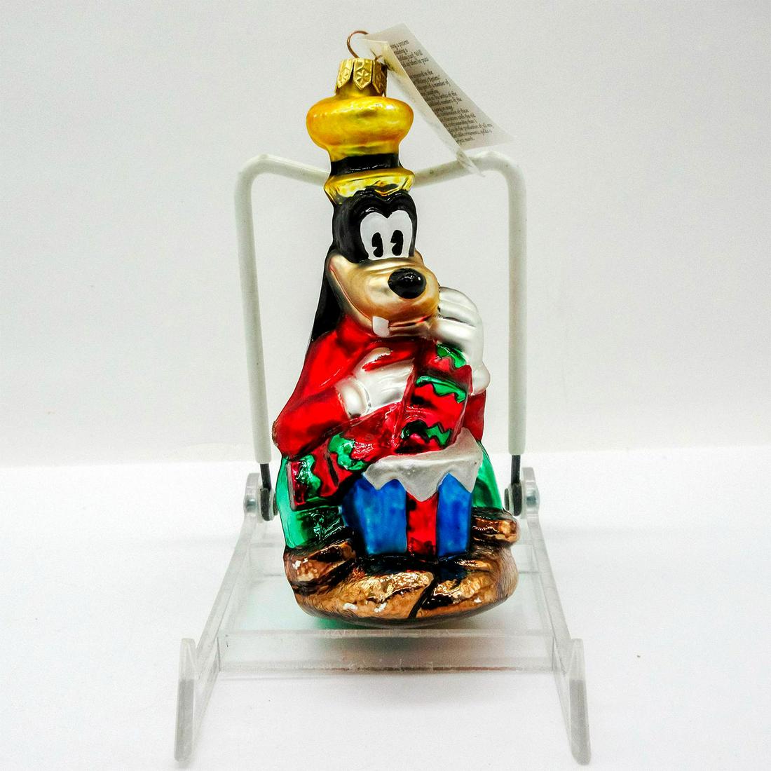 Christopher Radko Disney Ornament, A Goofy Surprise: Colorful hand painted glass ornament with glitter accent. Includes hang-tag. In original box, dimensions measure 8"L x 3.25"W x 3"H . Artist: Poland Issued: 1996 Dimensions: 2.25" W x 6" H Edition Siz