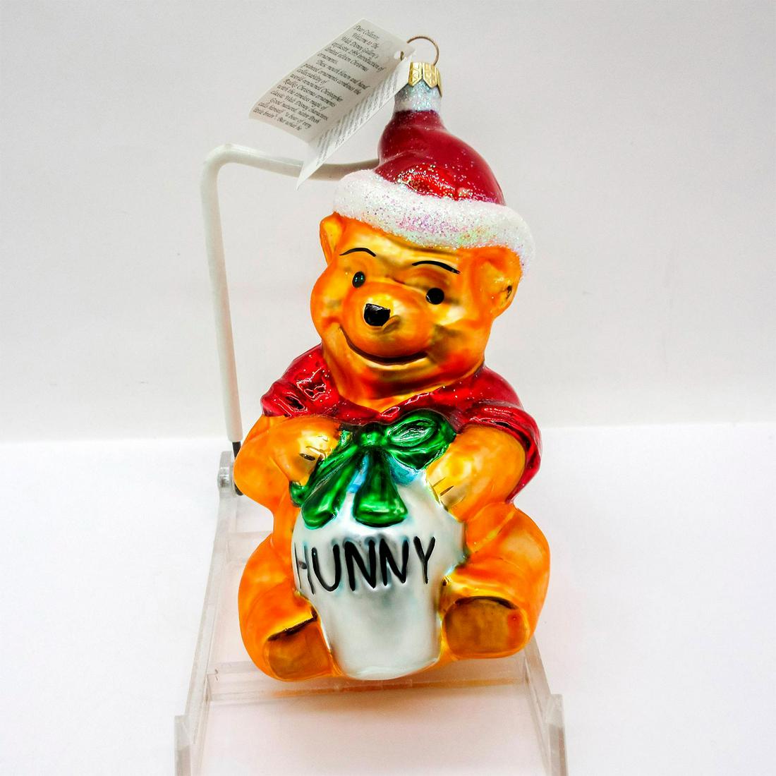 Radko Disney Ornament, Pooh's Favorite Gift: Limited edition, colorful hand painted glass ornament with glitter accent. Includes certificate of authenticity. In original box, dimensions measure: 7"L x 3.5"W x 3"H . Artist: Poland Issued: 1995 Di