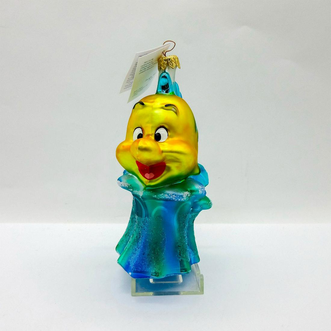 Radko The Little Mermaid Ornament, Flounder: Colorful hand painted glass ornament with glitter accent. Includes hang-tag. In original box, dimensions measure 8.5"L x 4.5"W x 2.75"H . Artist: Poland Issued: 1997 Dimensions: 2.5" W x 6.5" H Editio