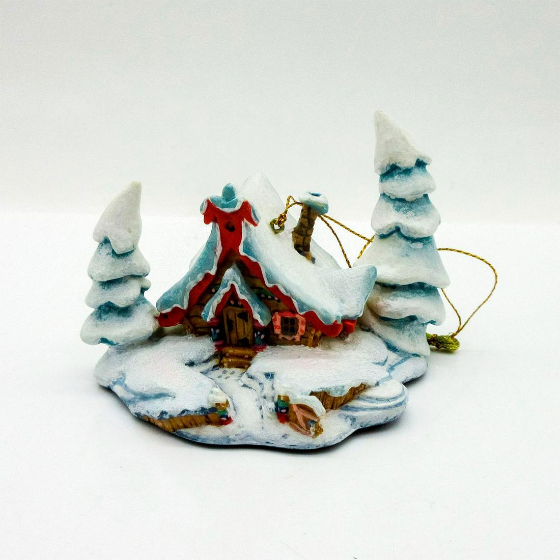 Disney Ornament, Nestled in the Snow, Peter and the Wolf: Resin ornament of a wintry snow-covered scene of idyllic cottage in the woods from Peter and the Wolf. Walt Disney Classics Collection backstamp. In original box, 3.5"H x 7.5"W x 5"L. Includes Certifi
