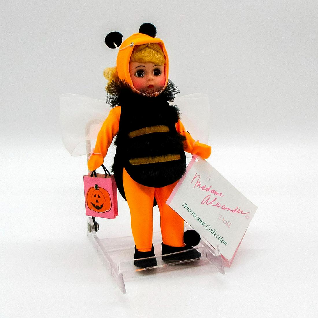 Vintage Madame Alexander Doll, Bumble Bee: Americana Collection. Jointed arms and legs. Wrist tag attached. This item has its original box. Dimensions of box: 8.25"L x 3.5"W x 8.25"H. Issued: 1992 Dimensions: 8" H Manufacturer: Madame Alexande