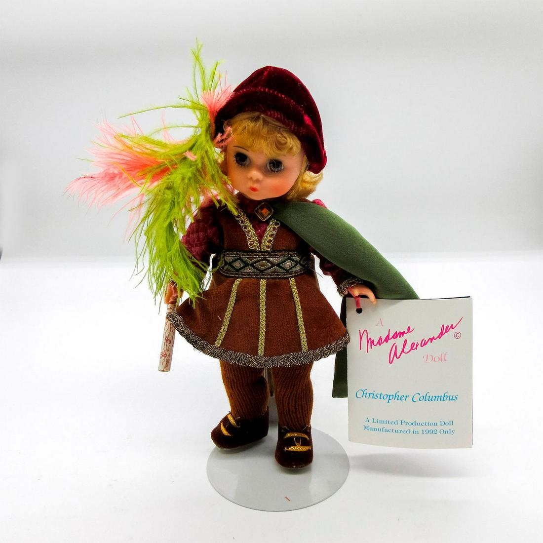 Vintage Madame Alexander Doll, Christopher Columbus: Limited Edition, commemorating the 500th anniversary of the discovery of the new world. Dressed in brown tights and tunic, with red shirt and green cape. Madame Alexander backstamp on back. Dimensions