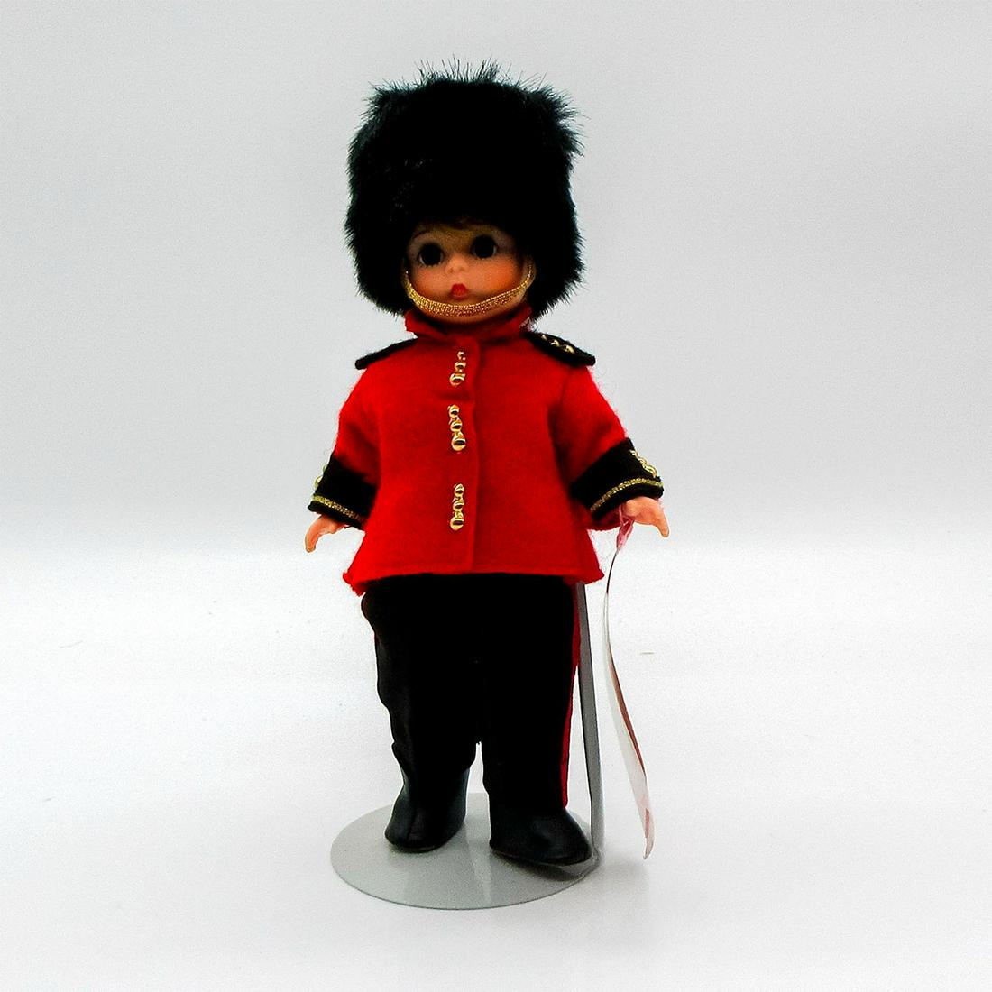 Vintage Madame Alexander Doll, England: International Collection. Portrays an English Guardsman. Jointed with moving eyelids. Includes stand. Wrist tag attached. This item has its original box. Dimensions of box: 8.25"L x 3.5"W x 8.25"H. Di