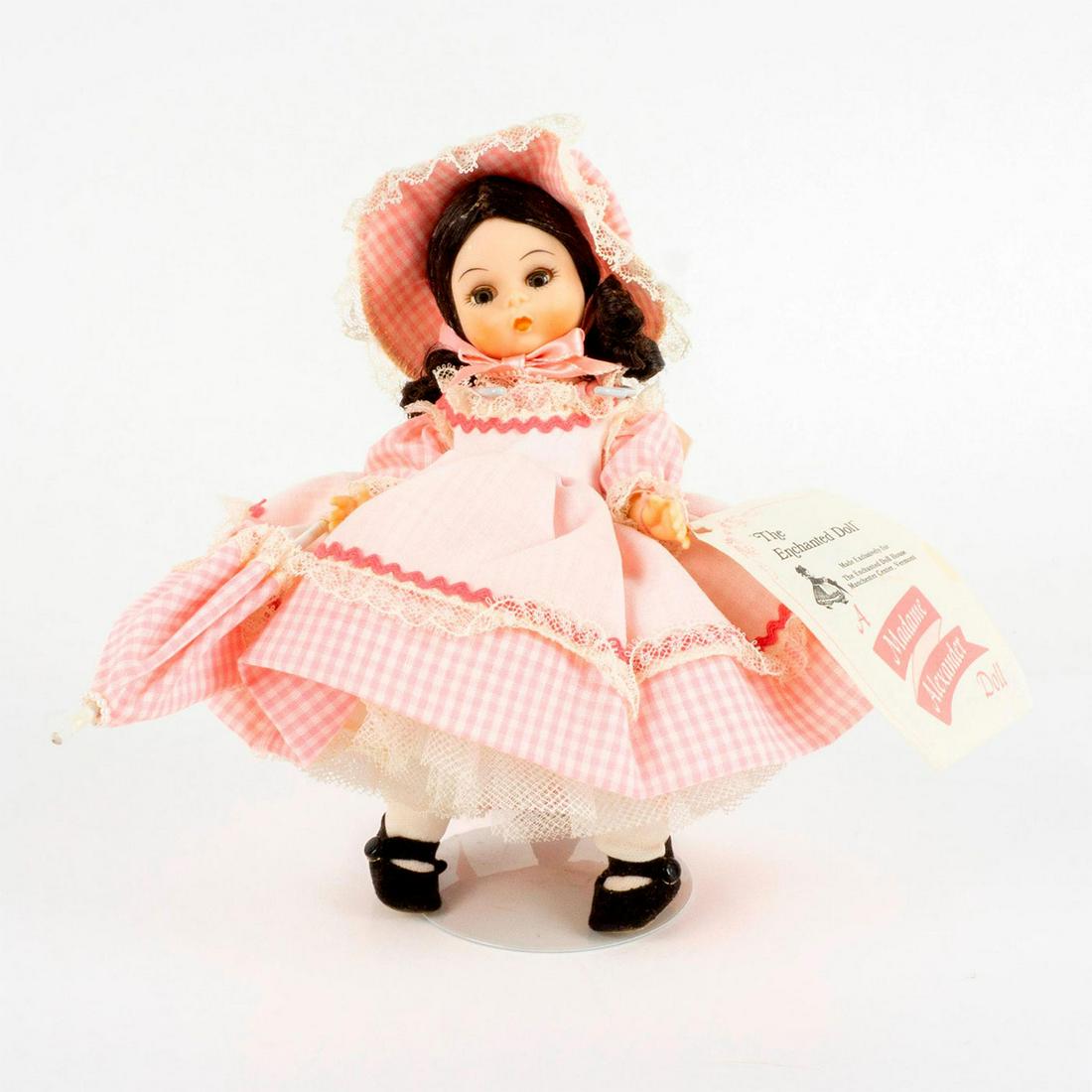 Vintage Madame Alexander Doll, The Enchanted Doll: Made for The Enchanted Doll house. Comes with a pink dress and extra shoes. Jointed with moving eyelids. This item has its original box with dimensions of 7.75"L x 9"W x 3.5"H. Dimensions: 2" L x 4" W