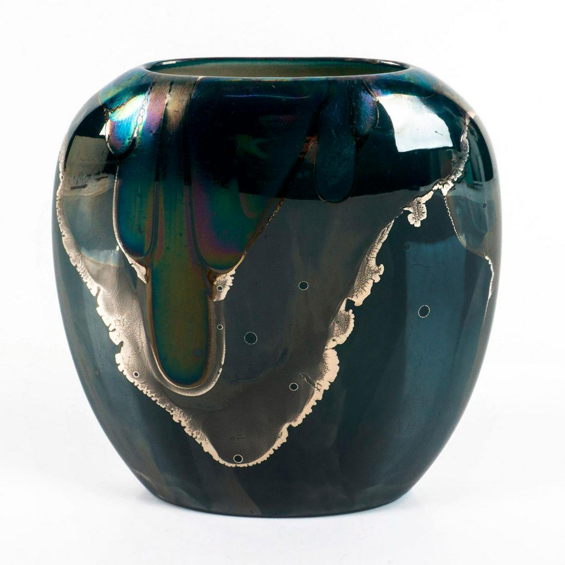 Nielsen's Ceramic Platinum Overlay Luster Vase: Turquoise lustre vase with a silver and prismatic marble effect overlay. Nielsen's Ceramic backstamp. Issued: 1989 Dimensions: 5.25" L x 2.5" W x 5.5" H Manufacturer: Nielsen's Ceramic Country of Orig