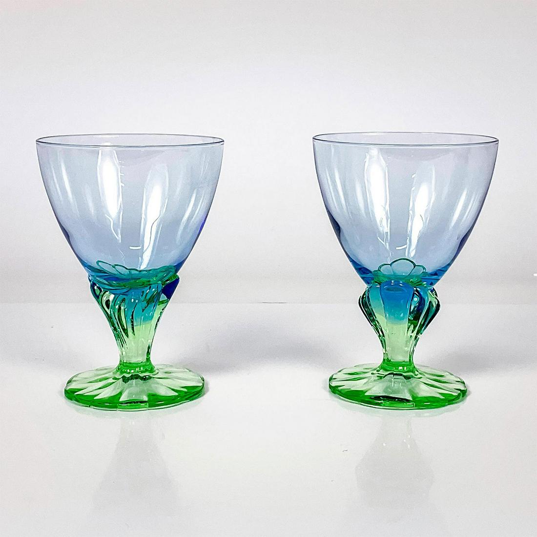 2pc Bormioli Rocco Wine Glasses, Bahia: Pair of Bahia design goblets for wine, juice, ice tea or sorbet with soft emerald green figural stems and pastel sapphire blue bowls. Dimensions: 5.5" H Manufacturer: Bormioli Rocco Country of Origin: