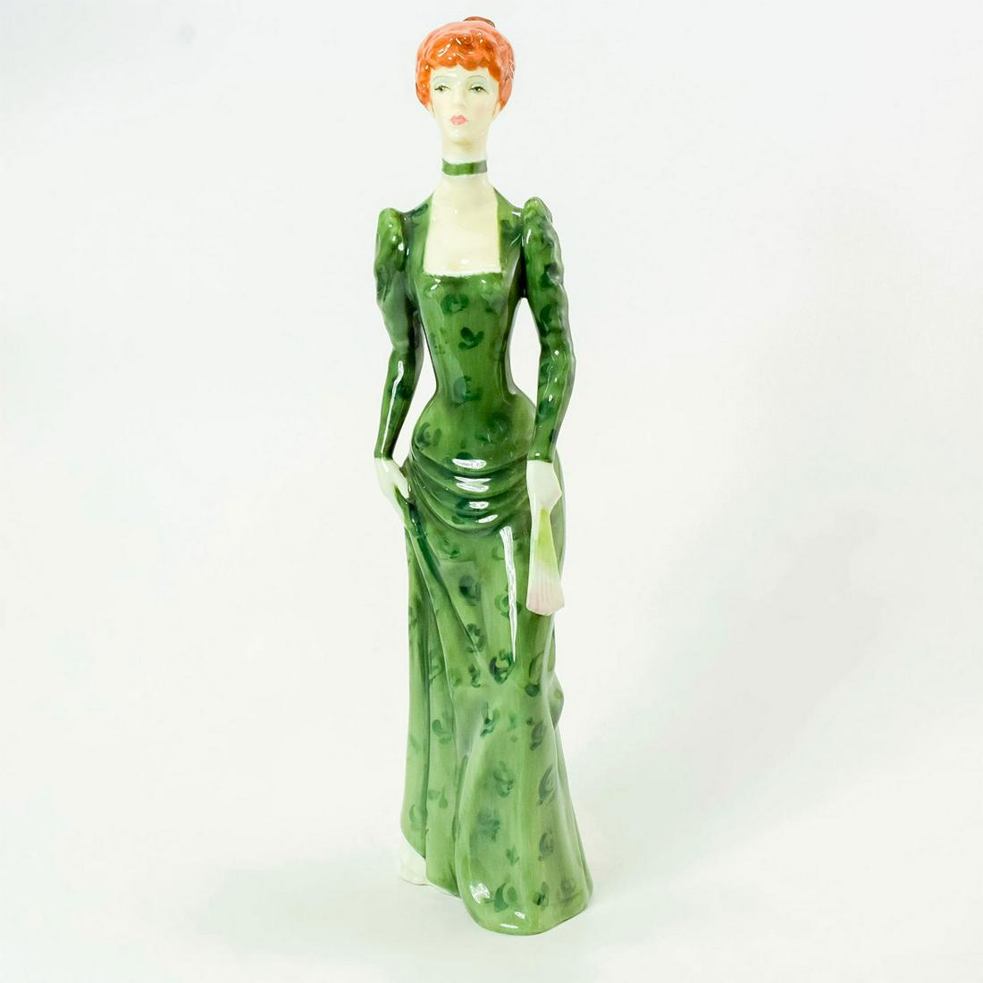 A la Mode HN2544 - Royal Doulton Figurine: Part of the Haute Ensemble Collection series. Royal Doulton backstamp. Artist: Eric J. Griffiths Issued: 1974 - 1979 Dimensions: 12.25"H Manufacturer: Royal Doulton Country of Origin: England