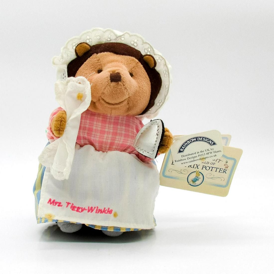 Rainbow Designs Beatrix Potter Stuffed Animal, Tiggy-Winkle: Features Tiggy-Winkle wearing white bonnet, pink plaid shirt, and striped skirt. Rainbow Designs tags. This item has no reserve. Issued: 20th c. Dimensions: 7" H Manufacturer: Rainbow Designs Country