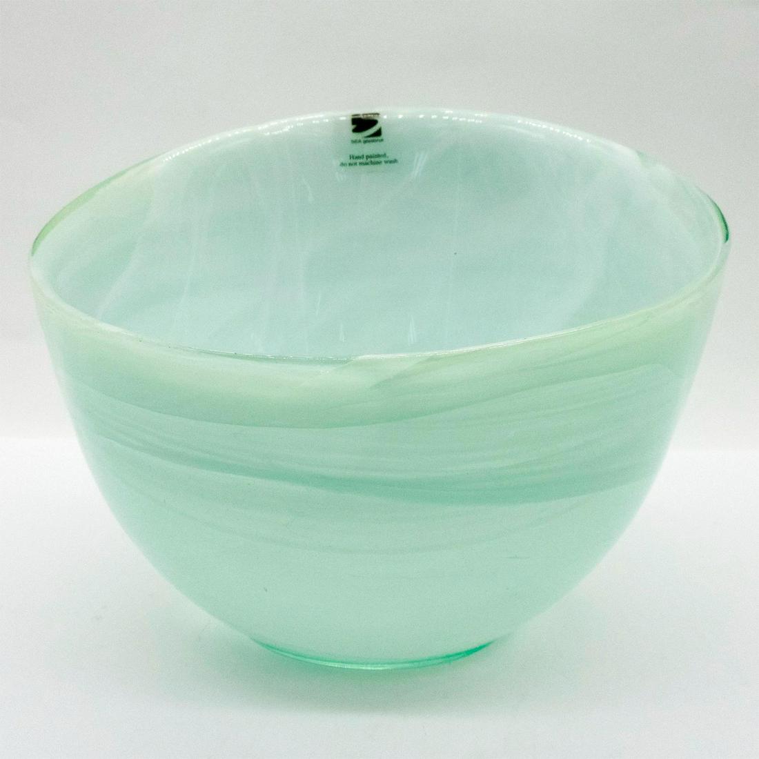 Sea Glasbruk Glass Bowl, Candy: Hand-painted turquoise glass bowl; asymmetrical rim, swirl design throughout body. Sea Glasbruk sticker on side. Comes with original box; size - 5.5"H x 6.75"W. Issued: 2011 - 2017 Dimensions: