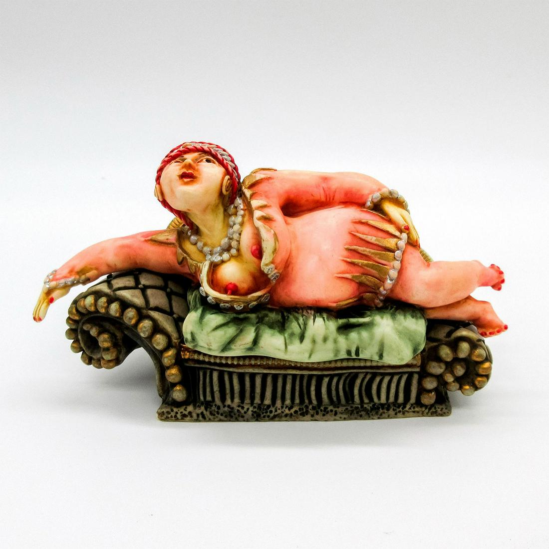 Harmony Kingdom Clair de Lune Trinket Box, Mme. Kiki: A crushed marble and resin figure of a French woman lounging on a couch. Inside is a bottle of wine and a book. Harmony Kingdom backstamps. Box: 6.25"L x 4"W x 4"H. #HarmonyKingdom #Figurine Artist: J