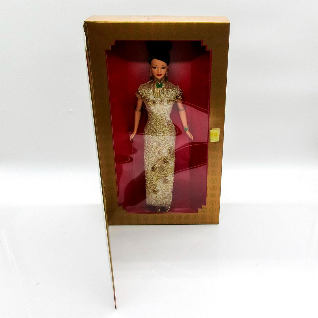 Mattel Barbie Doll, Golden Qi-Pao: Featuring a layer of golden lace, tiny crystals and golden rosettes throughout traditional Chinese garment. Limited Edition. #20866. In original box, unopened. Dimensions of box: 13.5"L x 3"W x 13.5"H