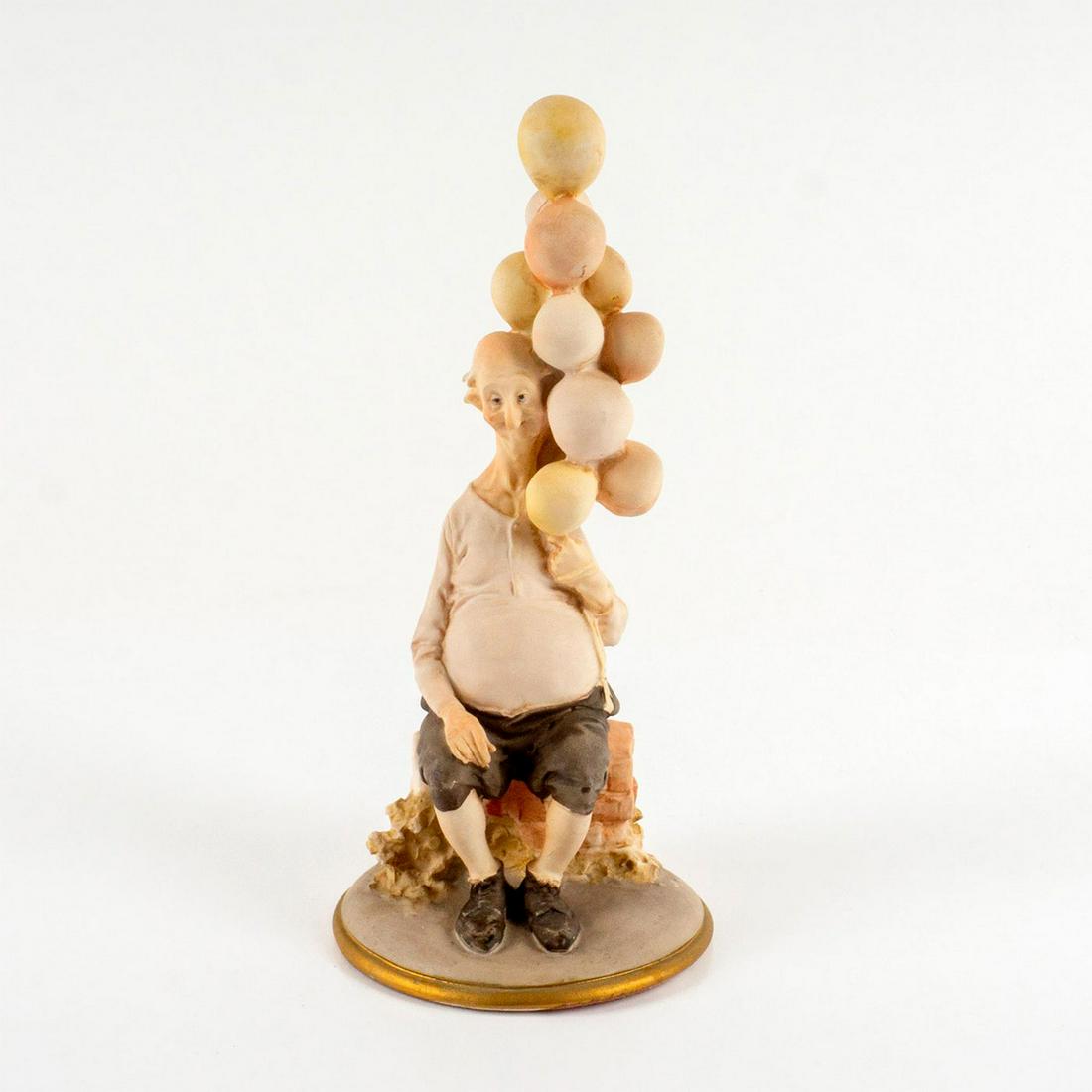 Vintage Capodimonte Figurine, Balloon Seller: Creamy pink tones. Capodimonte marked to backside. This item has no reserve. Dimensions: 8.5" H Manufacturer: Capodimonte Country of Origin: Italy