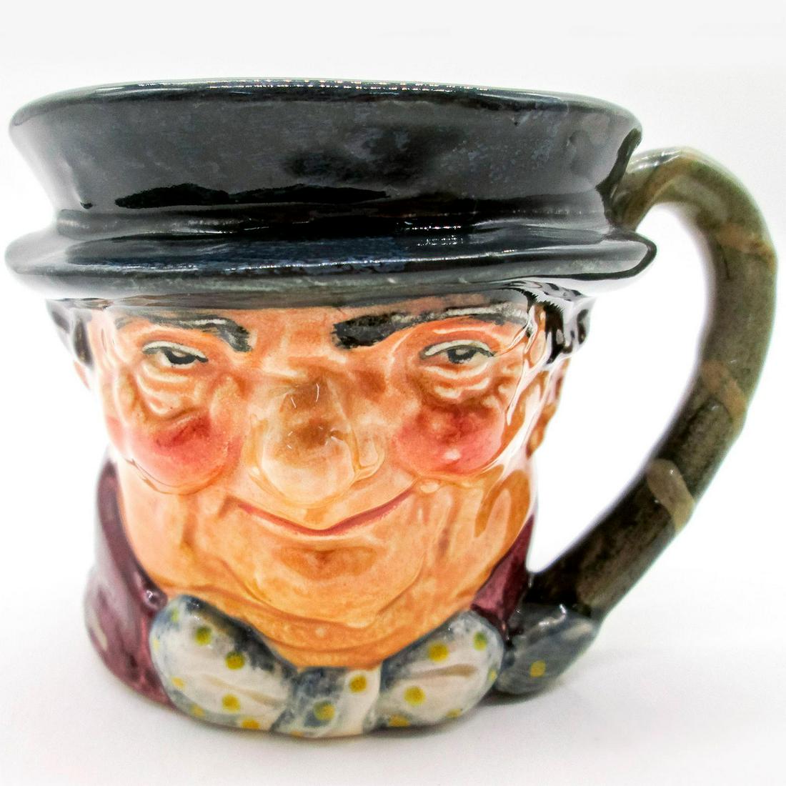 Tony Weller D5530 - Small - Royal Doulton Character Jug: Dark grey hat; maroon coat; grey-white bow with yellow spots. Series: Charles Dickens' Characters. Royal Doulton backstamp. Artist: Leslie Harradine and Harry Fenton Issued: 1936 - 1960 Dimensions: 3.
