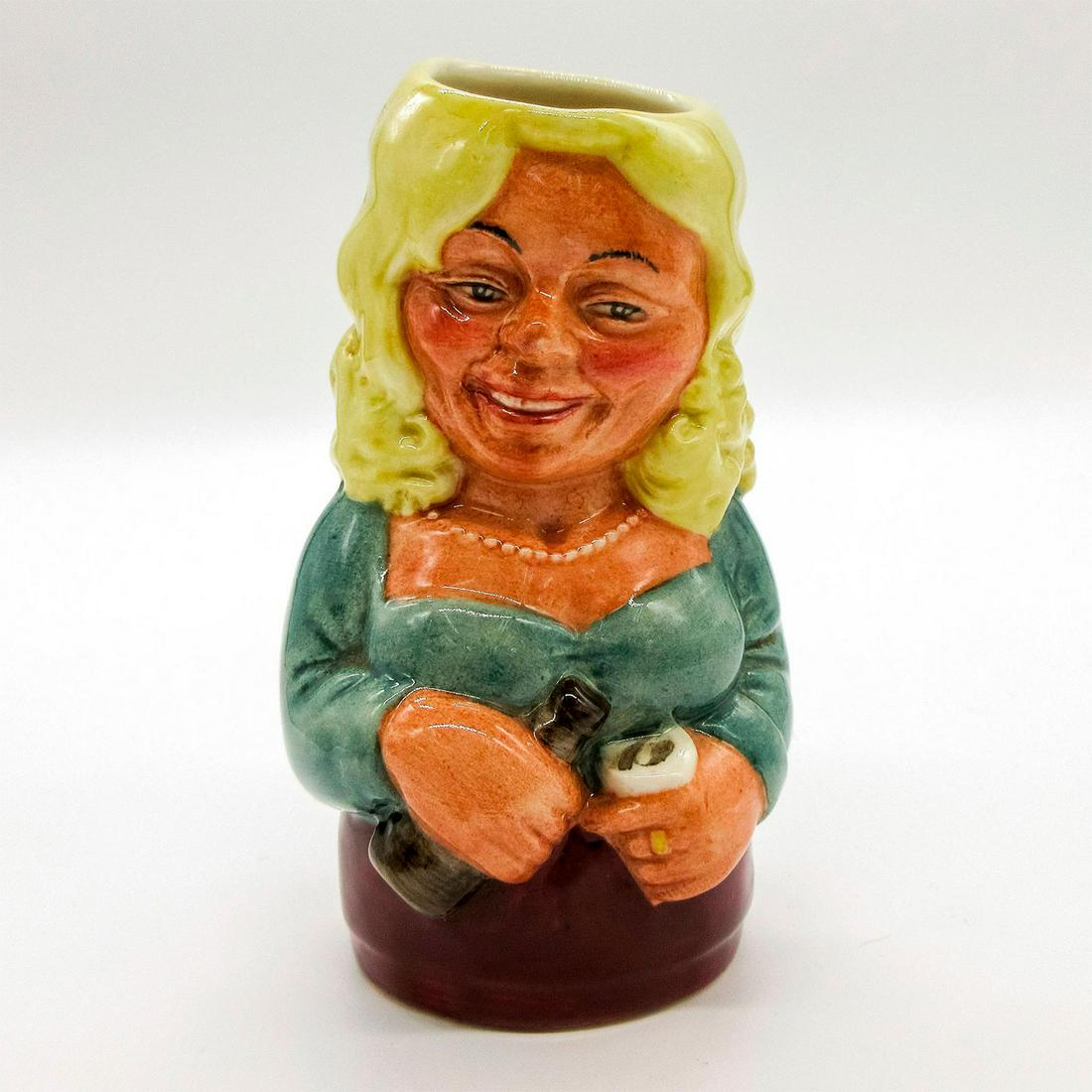 Betty Bitters the Barmaid D6716 - Royal Doulton Toby Jug: Green blouse; burgundy skirt; yellow hair. Series: The Doultonville Collection. Royal Doulton backstamp. Artist: William K. Harper Issued: 1984 - 1990 Dimensions: 4"H Manufacturer: Royal Doulton