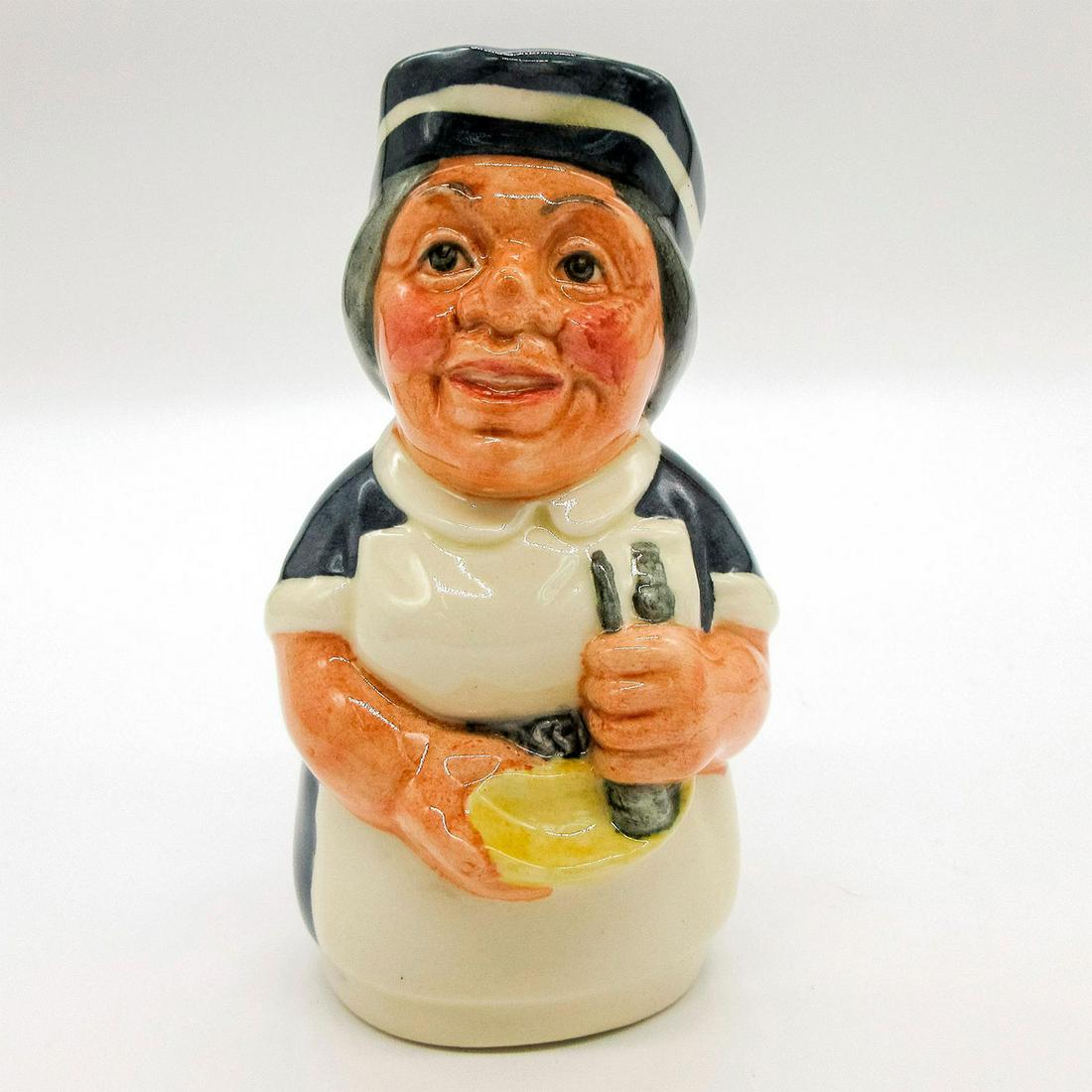 Miss Nostrum the Nurse D6700 - Royal Doulton Toby Jug: Blue uniform; white apron; blue and white cap. Series: The Doultonville Collection. Royal Doulton backstamp. Artist: William K. Harper Issued: 1983 - 1991 Dimensions: 4"H Manufacturer: Royal Doulton