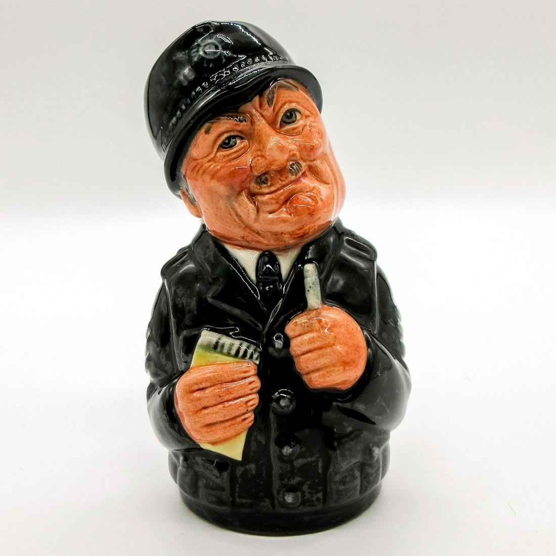 Sgt. Peeler the Policeman D6720 - Royal Doulton Toby Jug: Navy uniform. Series: The Doultonville Collection. Royal Doulton backstamp. Artist: William K. Harper. Issued: 1985 - 1991 Dimensions: 4''H Manufacturer: Royal Doulton