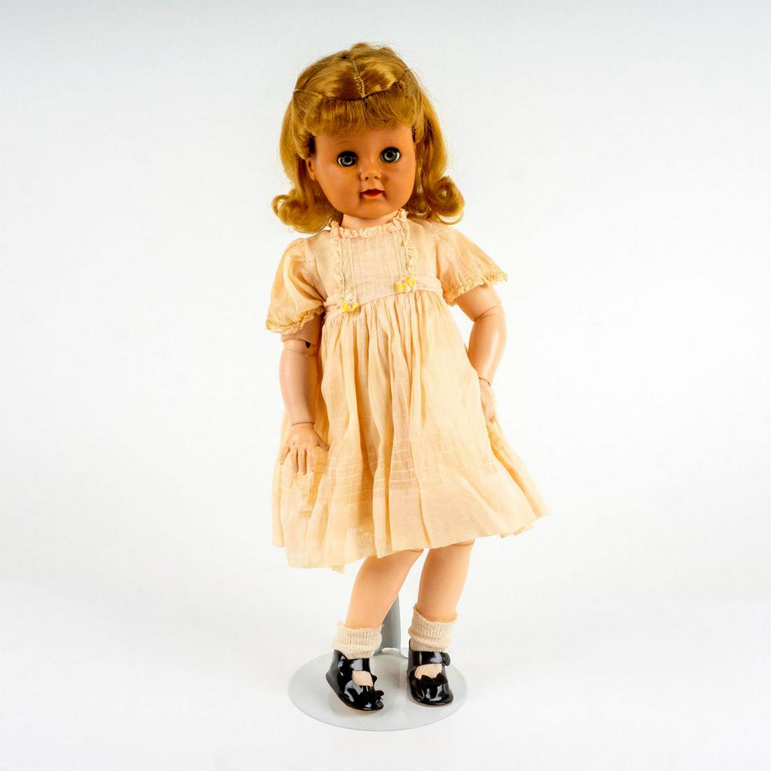 Vintage Madame Alexander Doll: Jointed with moving eyes on a stand. This item has no reserve. Dimensions: 6.5"W x 18"H Manufacturer: Madame Alexander Country of Origin: United States
