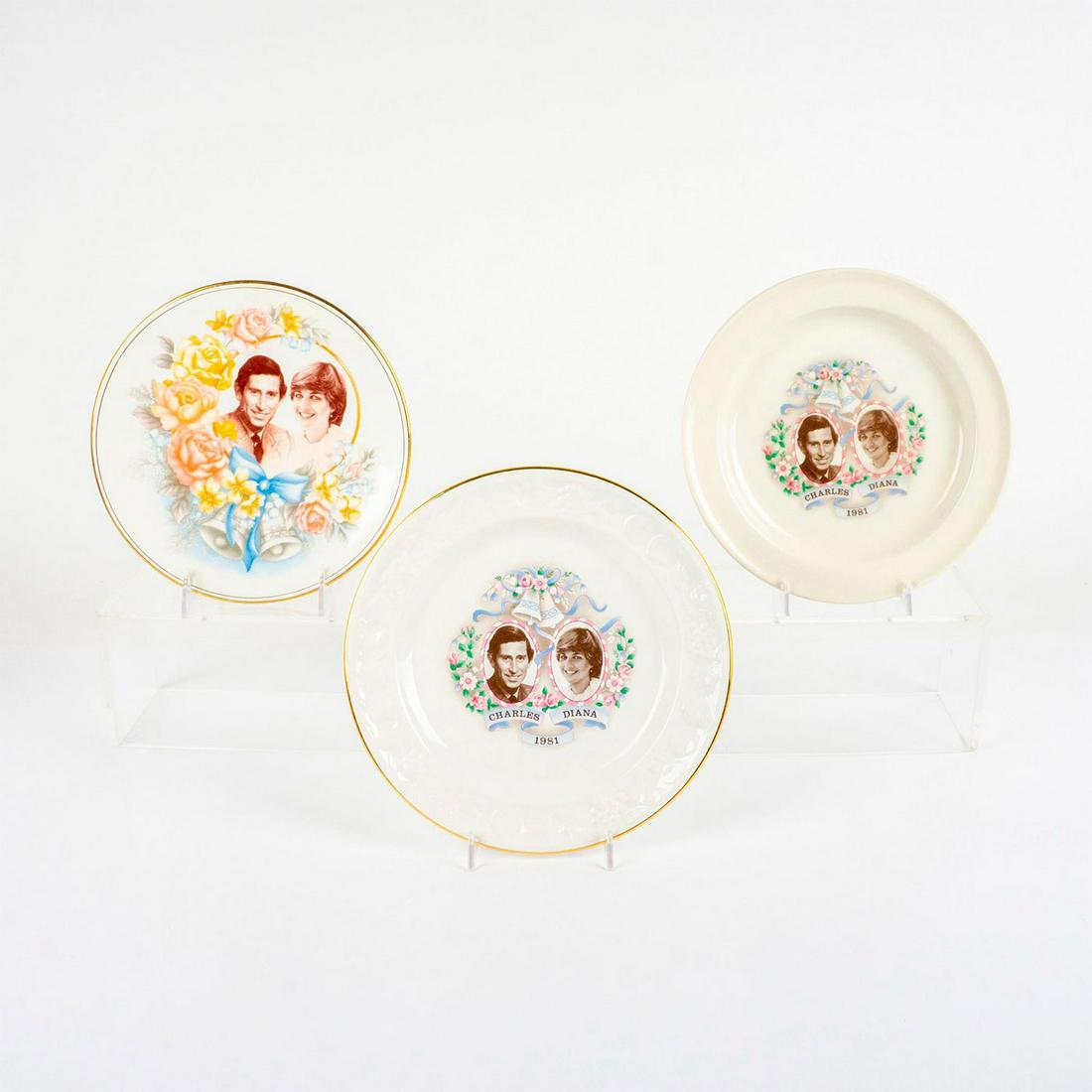 3pc Prince Charles and Lady Diana Celebrative Cabinet Plates: White porcelain and bone china with images of Prince Charles and Lady Diana. Art Ceramique, and Royal Worcester Spode Palissy backstamps. Box: 9.5"L x 9.5"W x 1.25"H. Issued: 20th c. Dimensions: 8.75"