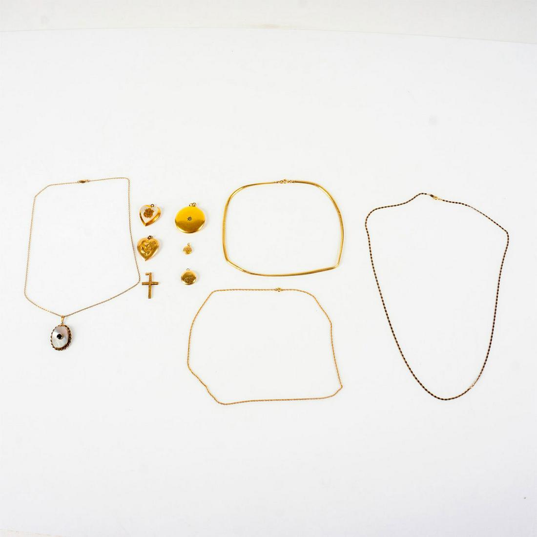 11pc Gold Filled Necklace and Locket Charm Jewelry Lot: Vintage 12kt G.F. jewelries; 5 locket charms, 3 chain necklaces, 1 cross charm and 1 necklace, Necklace with mother of pearl with black stone; 1/20 10kt GF impressed on back of locket pendant top and 