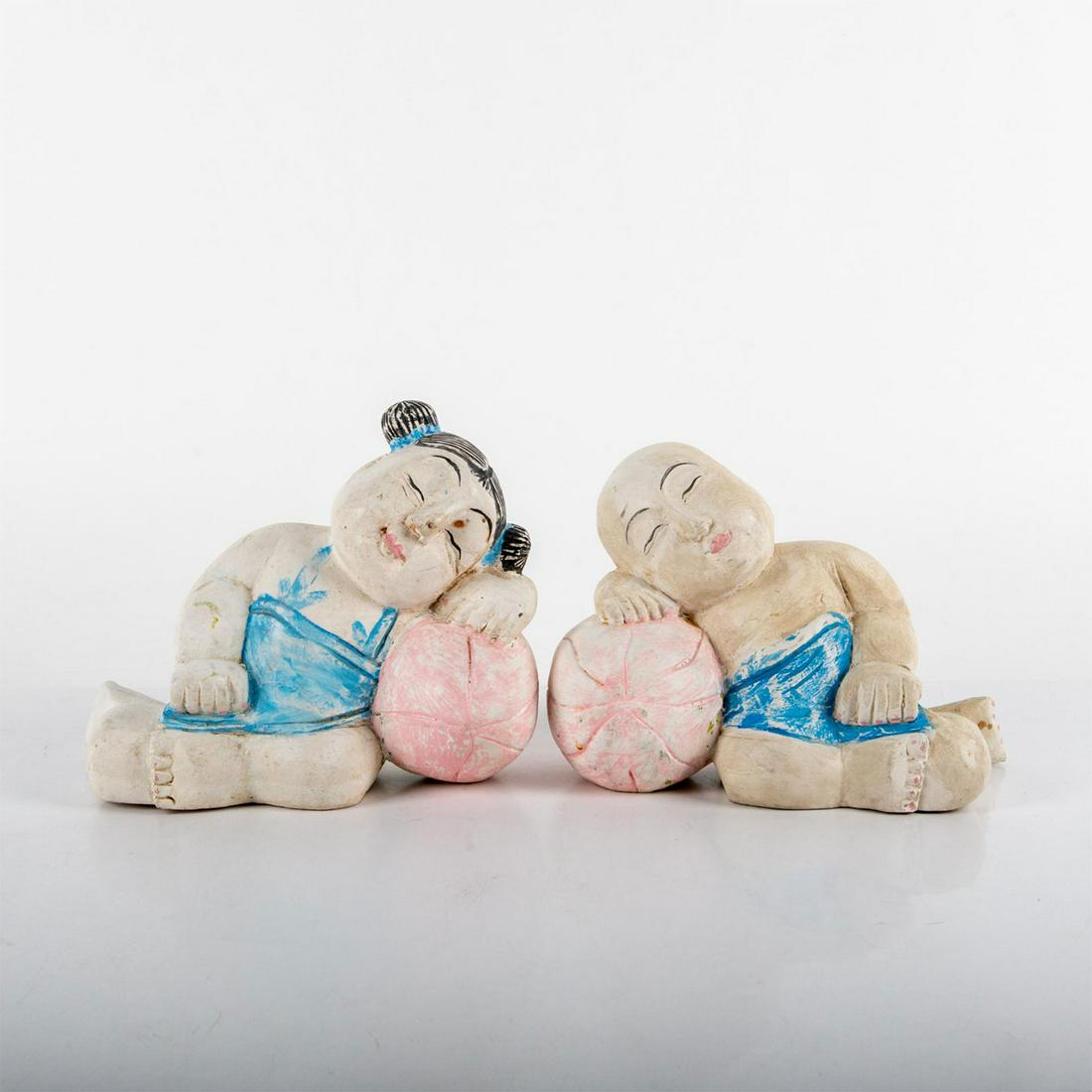 Set of 2 Vintage Asian Wooden Sleeping Children Figurines: Hand carved and hand painted; young boy and girl sleeping in mirrored positions. Manufacturer unknown; no markings. Age related wear throughout; faded paint, staining, and chipped wood. Boy: 5.5"H x 8