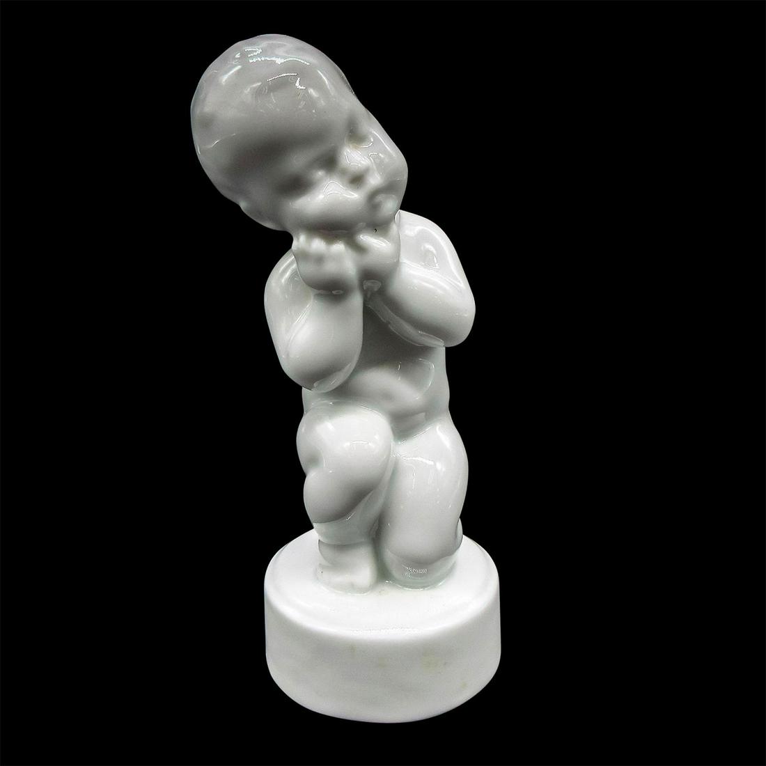 Vintage Bing & Grondahl Figurine, Toothache: Glossy finish in Blanc de Chine. Modeled as boy holding his cheek. Bing & Grondahl backstamp. Marked 2207. Dimensions: 4.5" H Manufacturer: Bing & Grondahl Country of Origin: Denmark