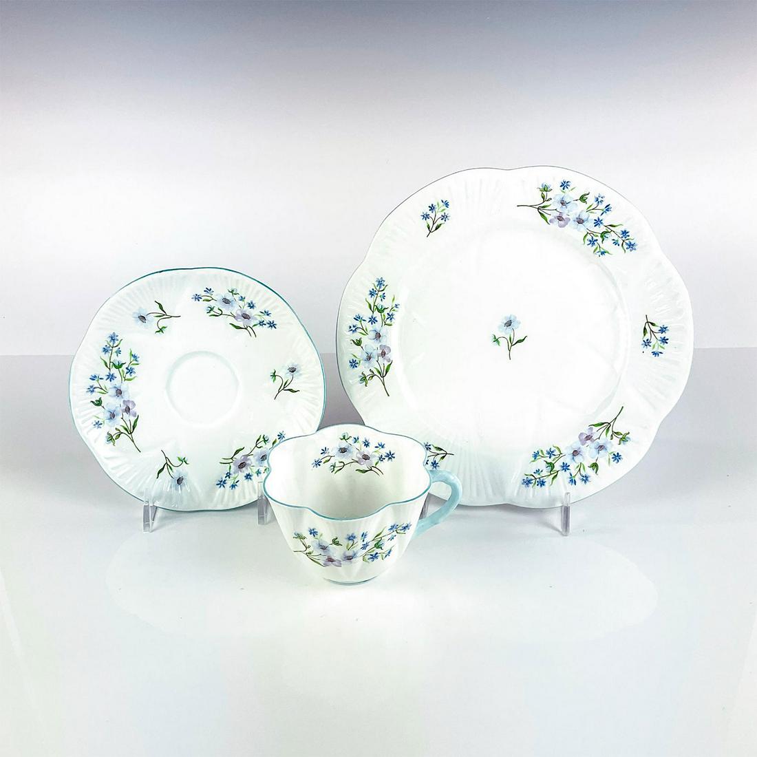 Antique Shelley Tea Set Trio, Blue Rock: Includes teacup, saucer, and plate. Bone china with a blue floral pattern and scalloped rim edge. This item has no reserve. Shelley England backstamp on base. Cup measures: 4”W x 2.75”H x