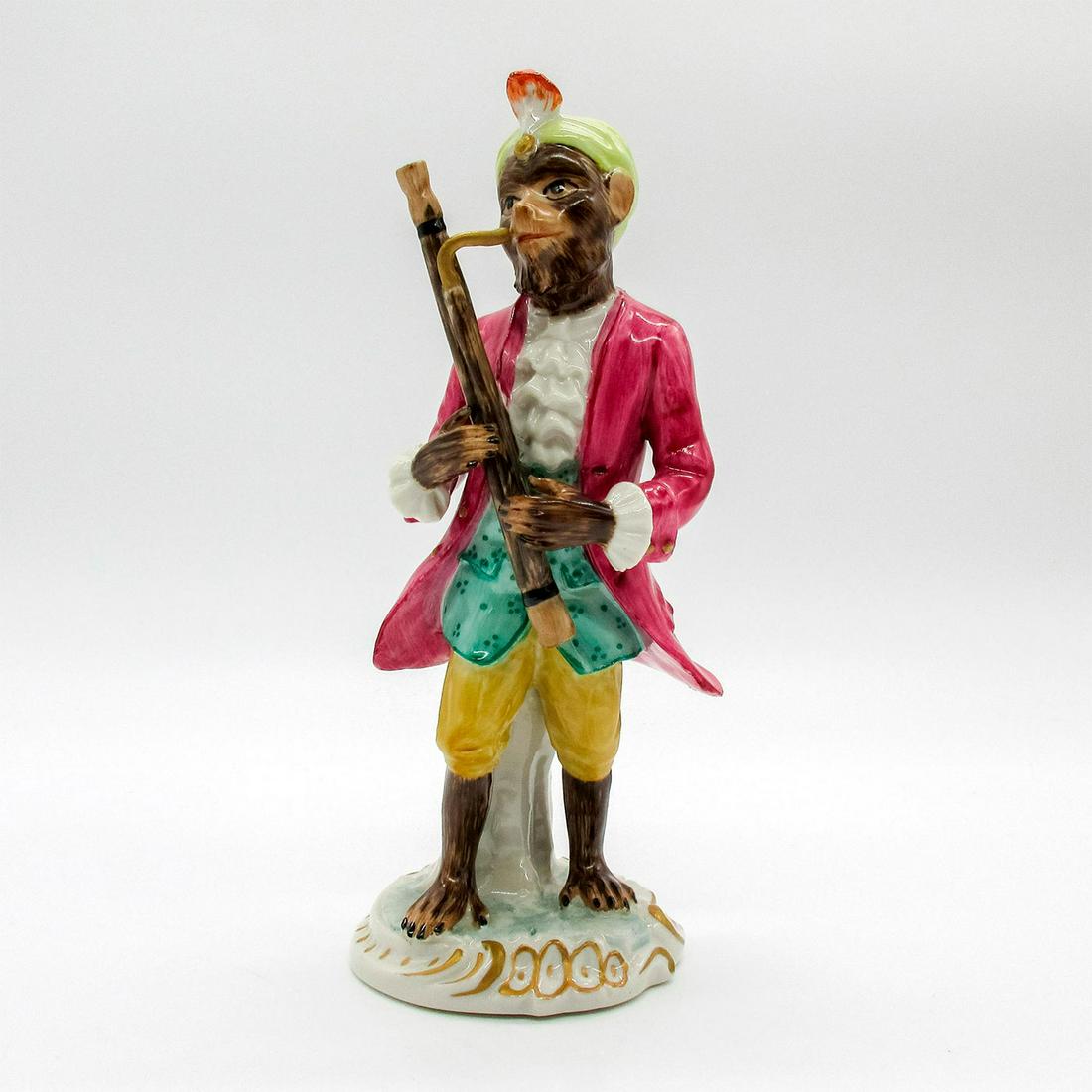 Chelsea House Port Royal Figurine, Monkey Bassoonist: Figurine modeled as monkey dressed in purple coat playing the bassoon. Gold gilt details. Part of the British National Trust Collection. After famous Monkey Band designed by Johann Joachim Kandler for