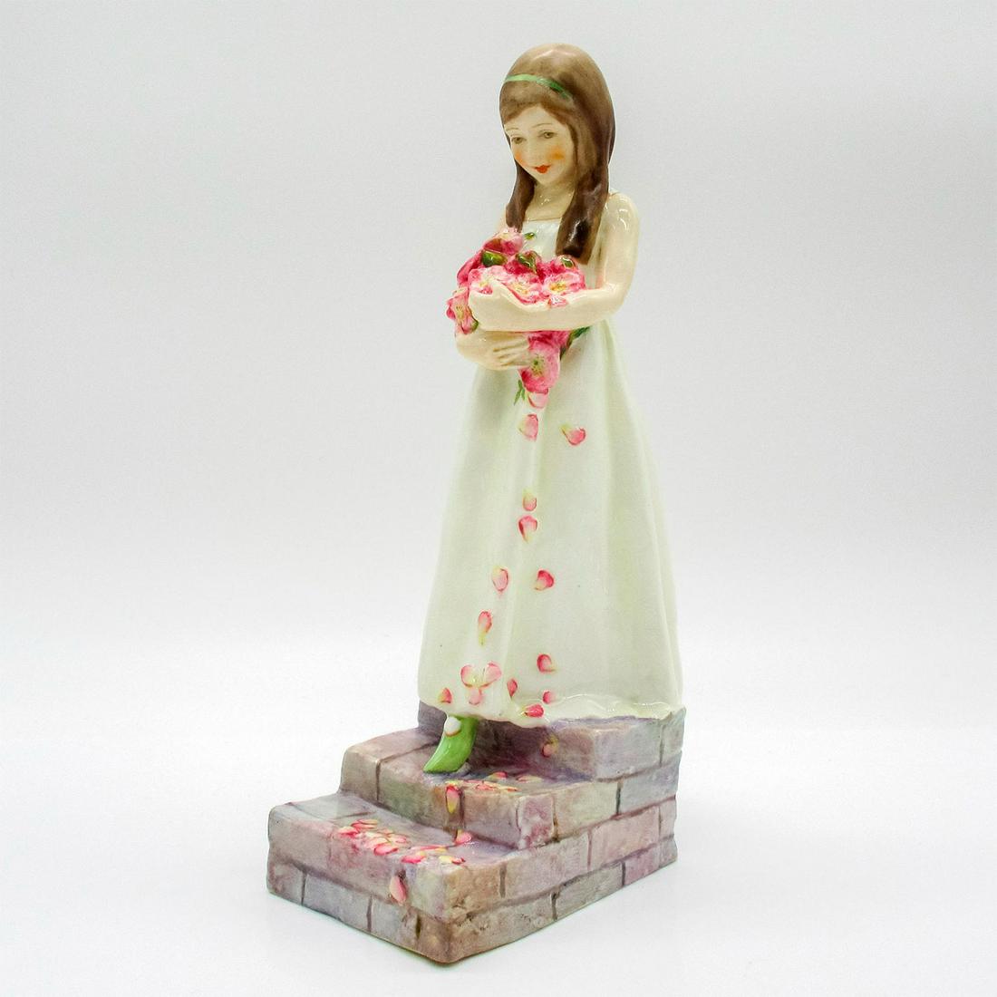 Royal Worcester Figurine, The Bridesmaid 3224: Figurine modeled as young smiling bridesmaid carrying a bouquet of pink flowers walking down staircase. Hand painted. Royal Worcester backstamp. Artist: Richard Moore Issued: 2005 Dimensions: 9"H Manu
