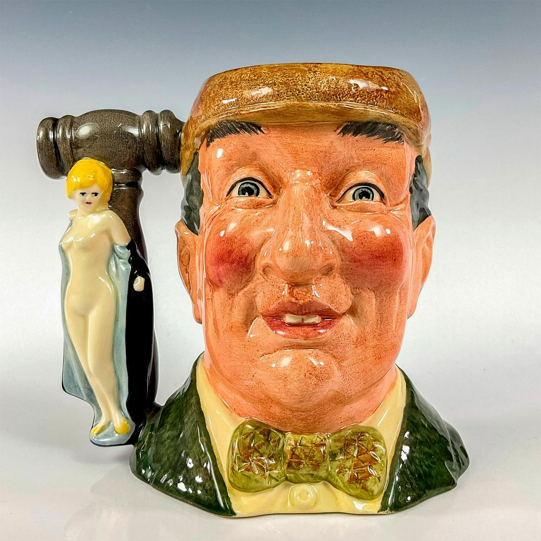 Auctioneer D6838 - Large - Royal Doulton Character Jug: Green coat and bow tie, light brown cap. Royal Doulton backstamp. Includes certificate of authenticity. Commissioned by Kevin Francis Ceramics Ltd., The Auctioneer jug was issued in 1988 in a limited 