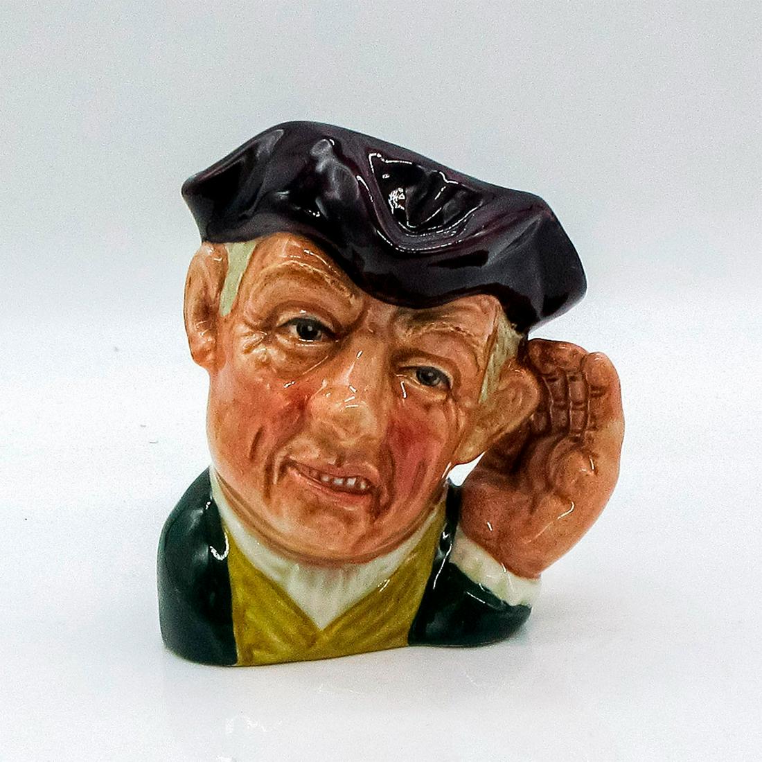 Ard of Earing D6591 - Small - Royal Doulton Character Jug: Dark purple tricorn; green, white, and yellow clothing. With handheld to cup his ear, this cockney gentleman is a comic representation of a deaf man. After being discontinued in 1967, this jug has inc