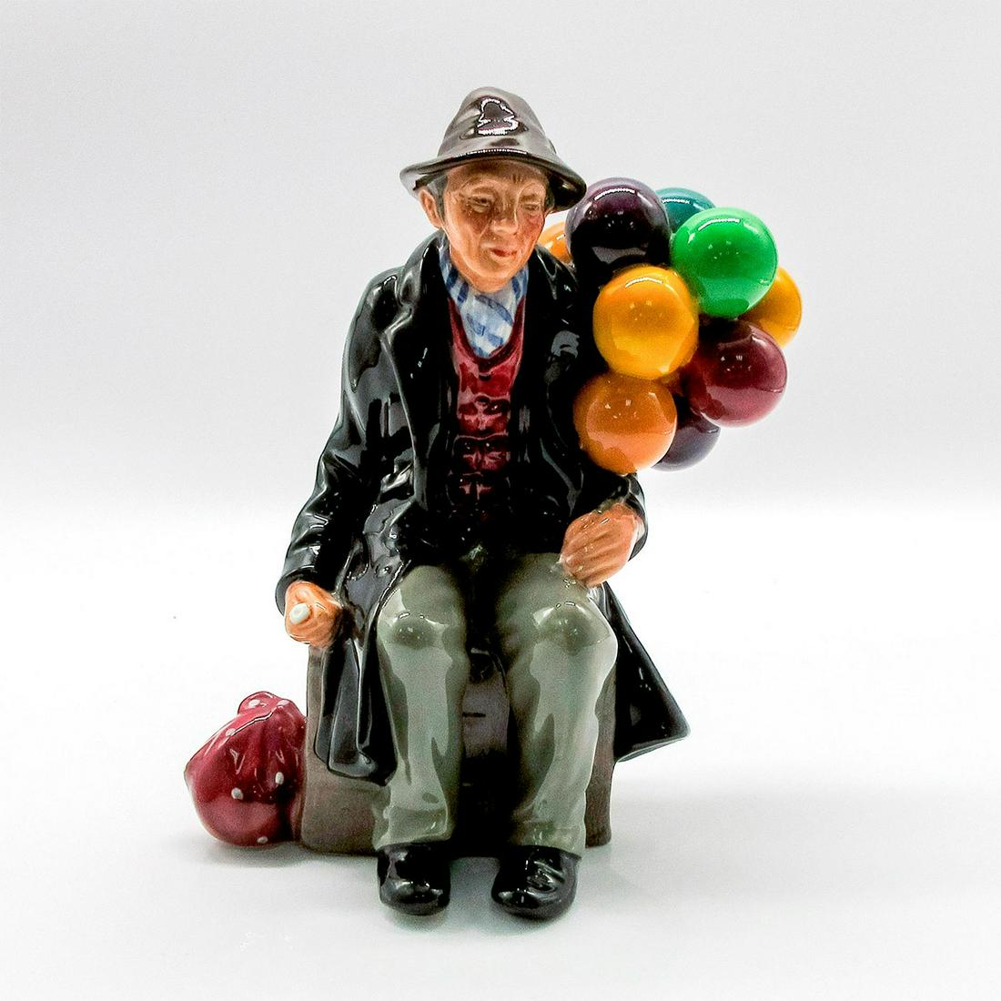 Balloon Man HN1954 - Royal Doulton Figurine: Balloon Characters series. Green, Purple and Black coloration. Royal Doulton backstamp. #RoyalDoulton #Art #Figurines Artist: Leslie Harradine Issued: 1940-2009 Dimensions: 7.5"H Manufacturer: Royal D