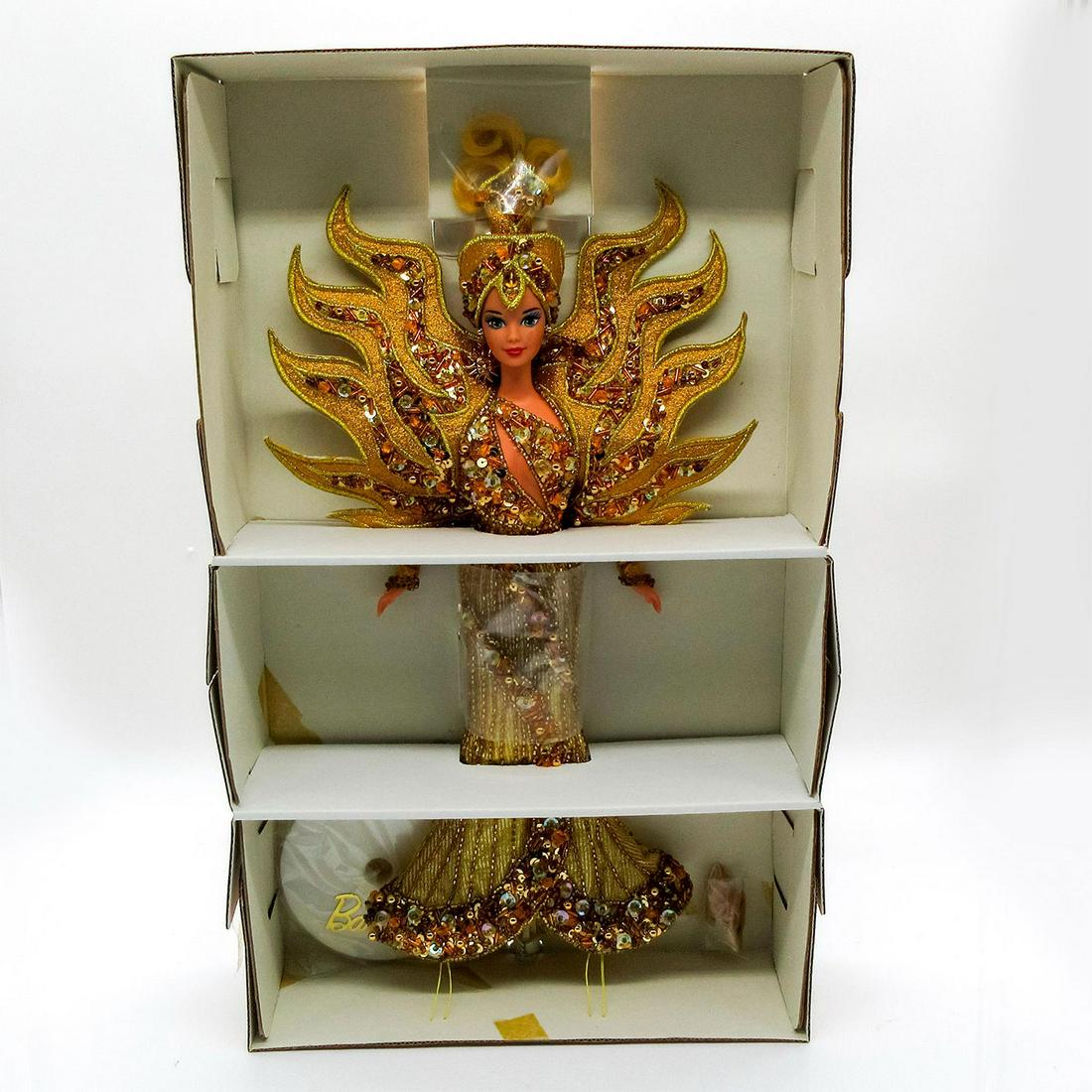 Mattel Barbie Doll, Goddess Of The Sun: Featuring radiant beauty; encrusted beading and elaborate sequins in one of a kind design by Bob Mackie. Limited Edition. #14056-0591. In original box, unopened. Dimensions of box: 16"L x 3.5"W x 16"H