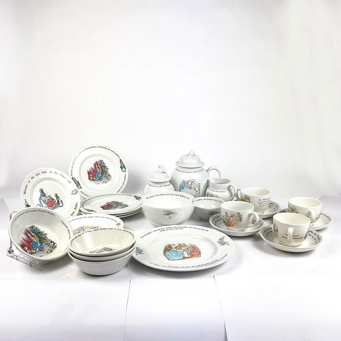 26pc Wedgwood Beatrix Potter, Peter Rabbit Tea Set: Includes 1 lidded teapot, 1 creamer, 1 lidded sugar bowl, 4 teacups, 4 saucers, 1 strawberry bowl, 1 small bowl, 4 oatmeal bowls, 8 plates, 1 serving plate with illustrations and scripts from the Tale