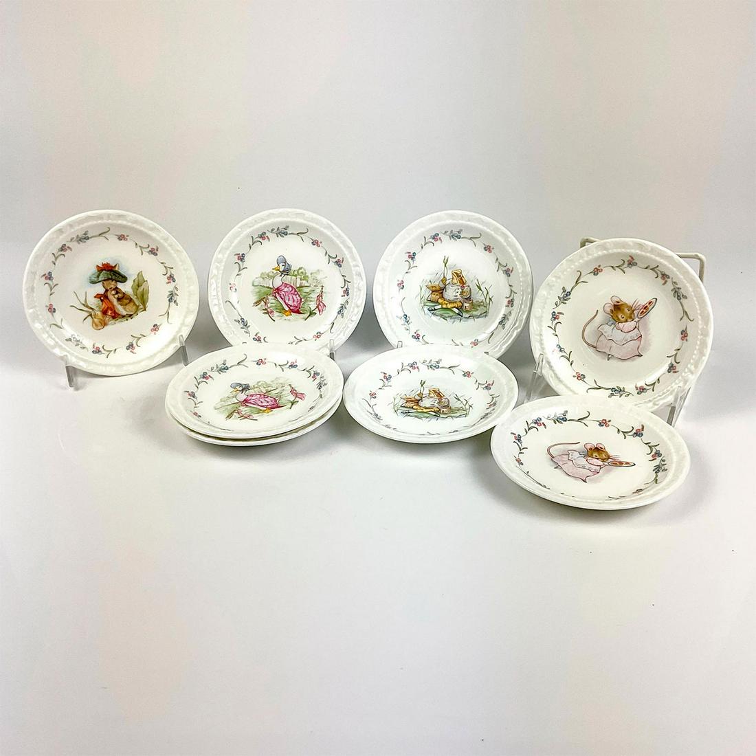 8pc Vintage Royal Albert Beatrix Potter Side Dishes: Bone China side plates with illustrations of Jemima Puddleducik, Benjamin Bunny, Jeremy Fisher, and Appley Dappley and floral pattern around the characters. Royal Albert and F.W & Co. backstamps. This