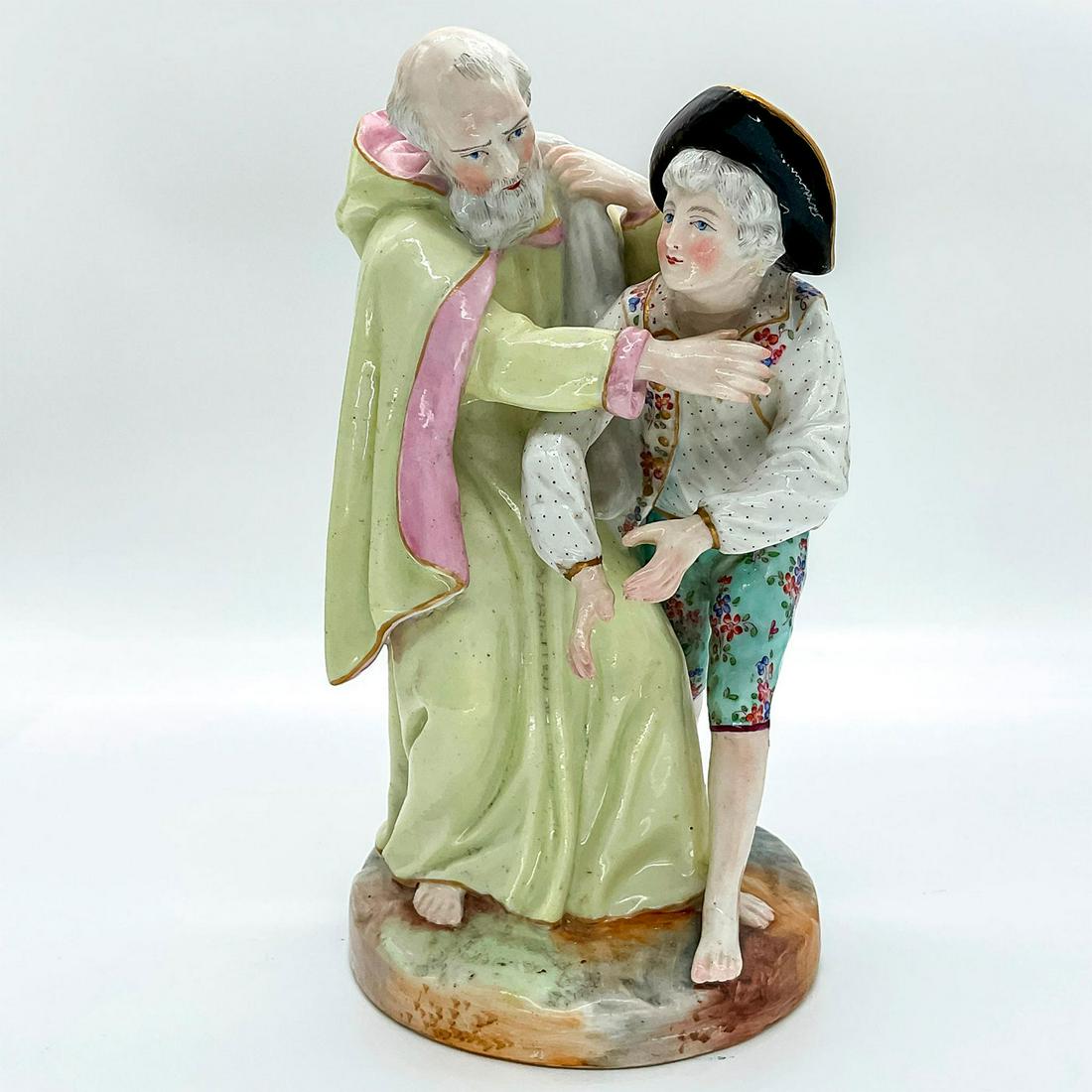 Antique Meissen Figurine, Priest and Boy: Porcelain priest restraining boy with broad brimmed hat. Meissen backstamp. Dimensions: 11" H Manufacturer: Meissen Country of Origin: Germany