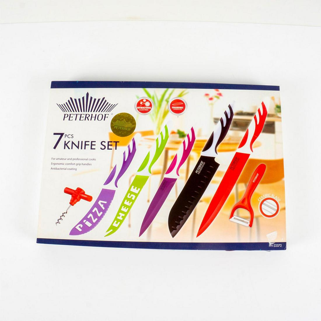 7pc Peterhof Knife Set: Colorful set including ceramic peeler, wine opener; pizza, cheese, utility, slicer and santoku knives. In original box 1.5"H x 14.75"W x 10.25"L. Manufacturer: Peterhof Country of Origin: Italy
