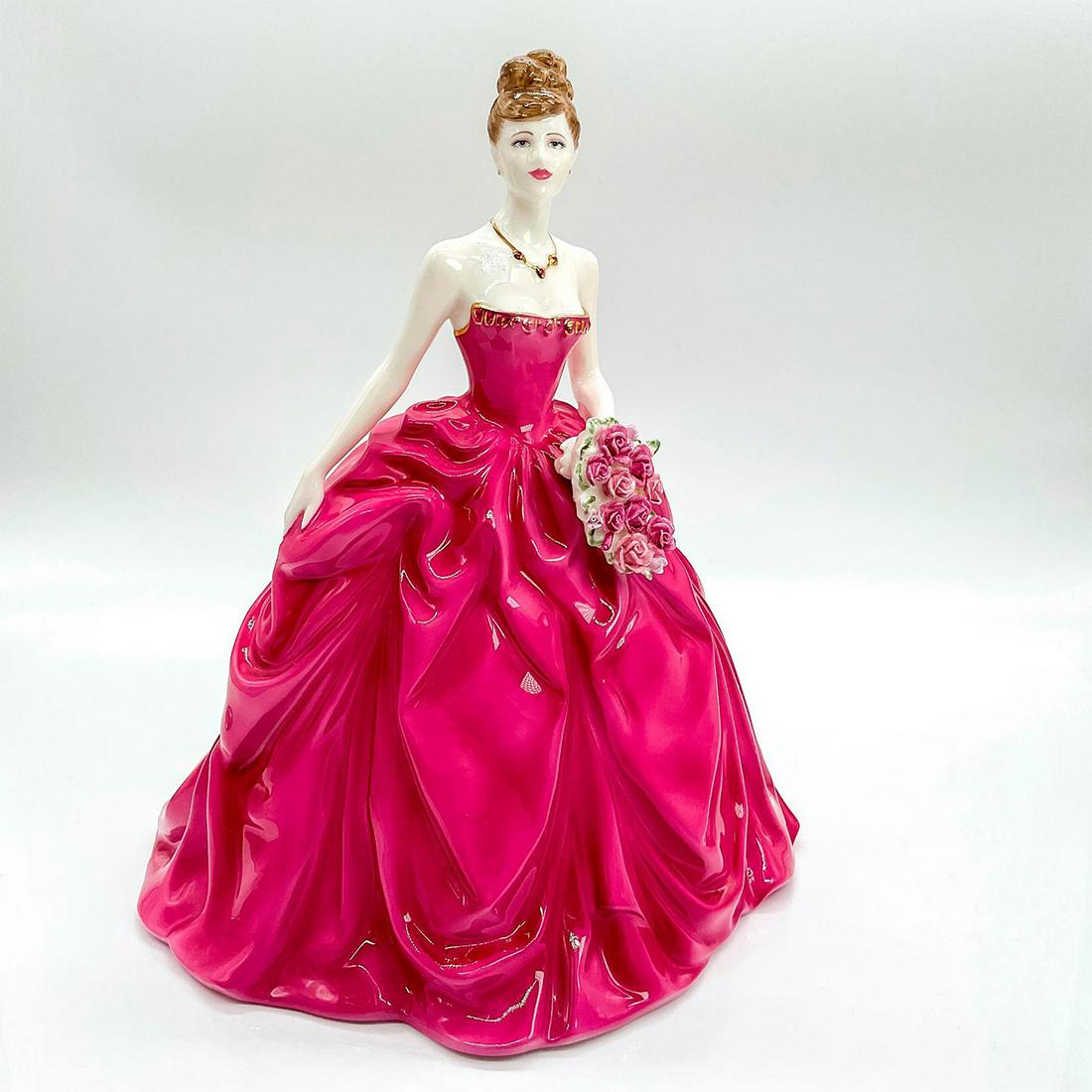 Coalport Figurine, Grand Finale: Limited edition bone china figurine depicting lady in a fiery rose pink strapless gown, holding a bouquet of pink and soft pink of roses; gold gilt touches on dress and necklace. Coalport backstamp. T