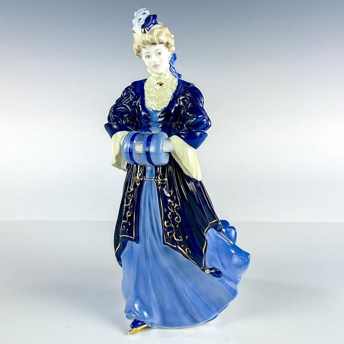 Coalport Figurine, Lady Harriet CW515: Special edition figurine modeled as Lady Harriet in dark blue late 1800's style dress and skates. Gold gilt details. Part of the Royal Skating Party Collection. Coalport backstamp. Issued: 20th c. Dim