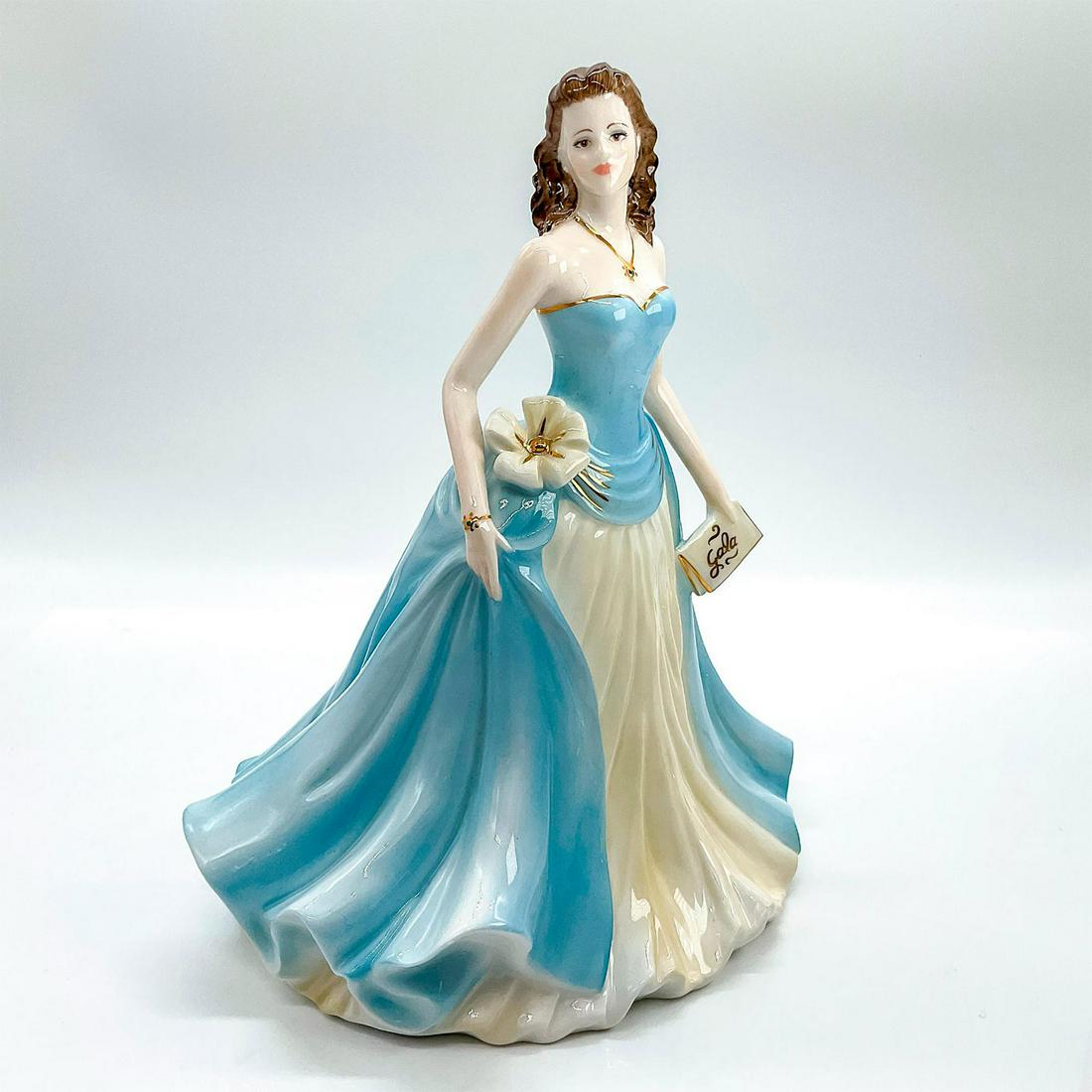 Coalport Figurine, Lady Helen At The Gala: Limited edition bone china that is part of the Society Ladies Collection. Depicts lady in a sky blue and cream colored strapless dress with gold gilt touches around dress, hand bag, bracelet, and neck