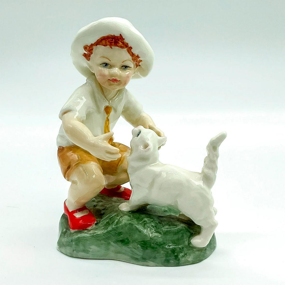 Royal Worcester Figurine, Snowy 3457: Hand painted fine bone china depicting a young child playing with a cat. Royal Worcester backstamp. Artist: F. G. Doughty Issued: 20th c. Dimensions: 2.25"W x 4.5"H Manufacturer: Royal Worcester Count