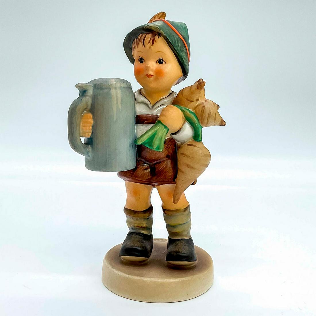 Goebel Hummel Figurine, For Father: Porcelain hand painted in matte finish. Goebel backstamp. Impressed M. I. Hummel to round base. Artist: M. I. Hummel Issued: 20th c. Dimensions: 2.5"W x 5.5"H x 2.5"Dia. Manufacturer: Goebel Hummel Co