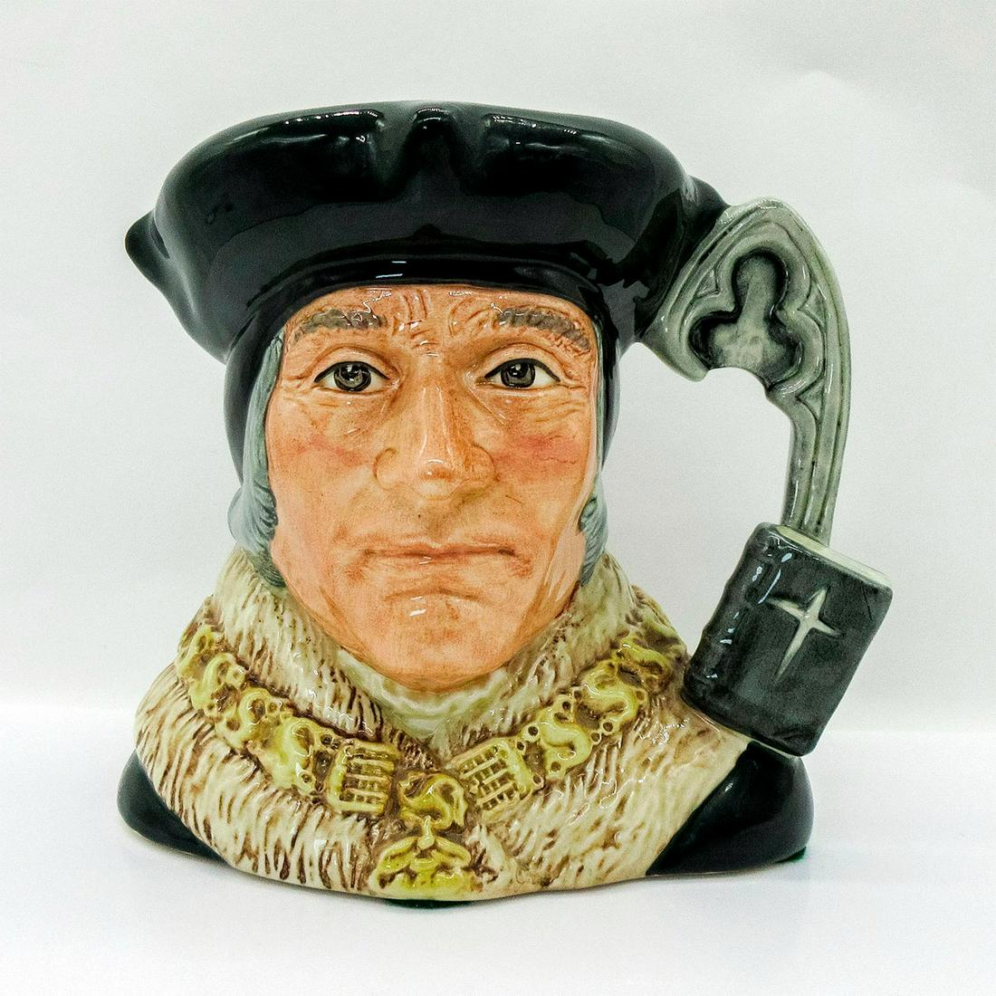 Sir Thomas More D6792 - Large - Royal Doulton Character Jug: Dark green hat, brown fur-trimmed collar, gold chain of office. Thomas More (1478 - 1535) entered the service of King Henry VIII in 1518 as a royal councilor. He was knighted and became Lord Chancello