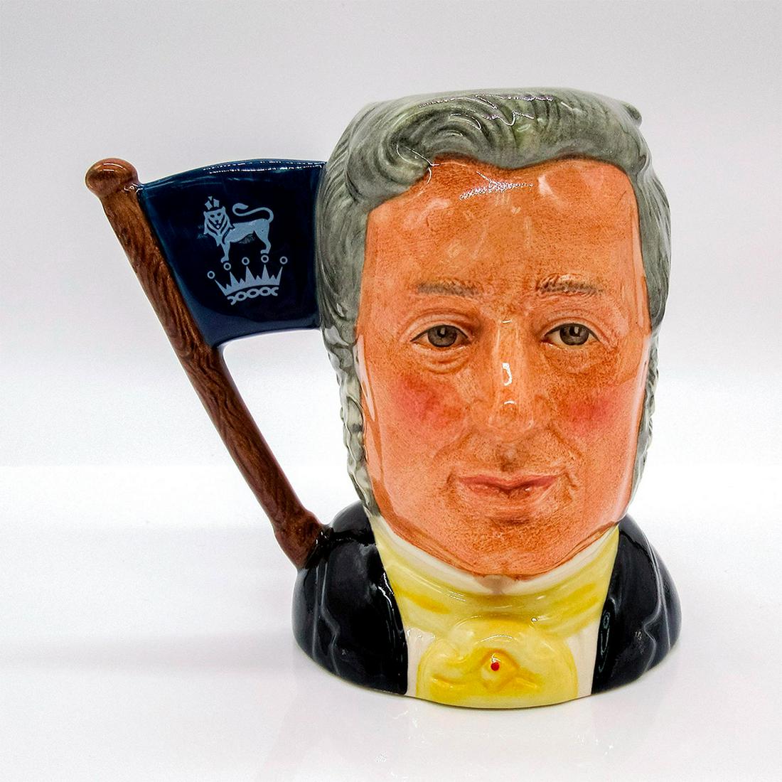 Sir Henry / Michael Doulton D6921 - Small - Royal Doulton Character Jug: Henry- Grey hair; yellow cravat; Michael- Brown hair; dark blue suit; white shirt; light blue tie. This two-faced jug was a special edition jug issued to mark Michael Doulton's personal appearances at