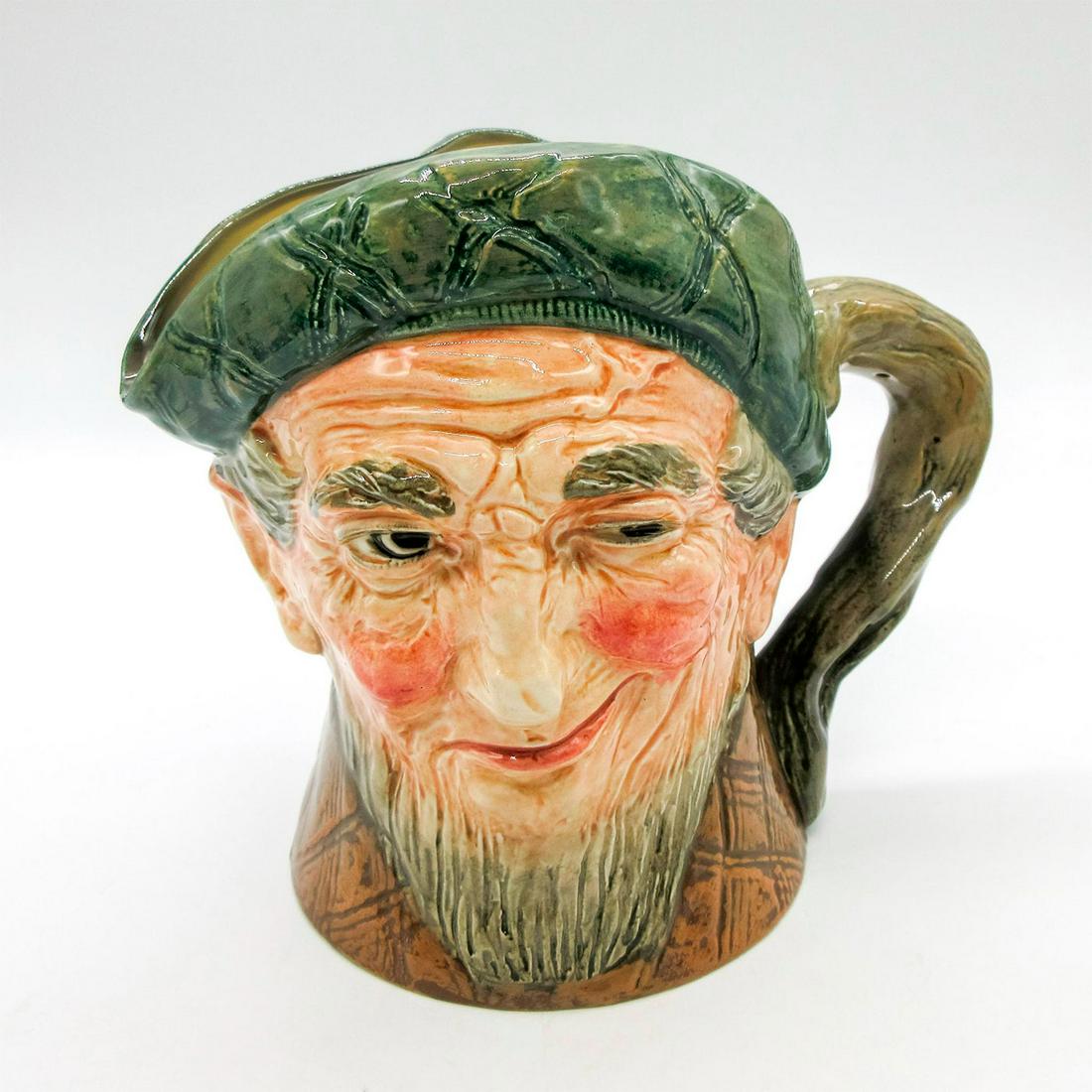 Auld Mac D5889 - Musical Jug - Royal Doulton: Green tam; brown coat. Musical jug plays the tune "The Campbells are Coming." A song by Sir Harry Lauder, a 20th-century singer and comedian, called "Bang Went Sixpence." inspired this piece. In it a