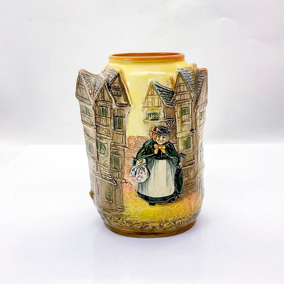 Royal Doulton Dickens Vase, Sairey Gamp: Depicting the nurse in the novel Martin Chuzzlewit by Charles Dickens in high-relief. Royal Doulton backstamp. Issued: 1908-1975 Dimensions: 5"L x 3"W x 6.75"H Manufacturer: Royal Doulton Country of O