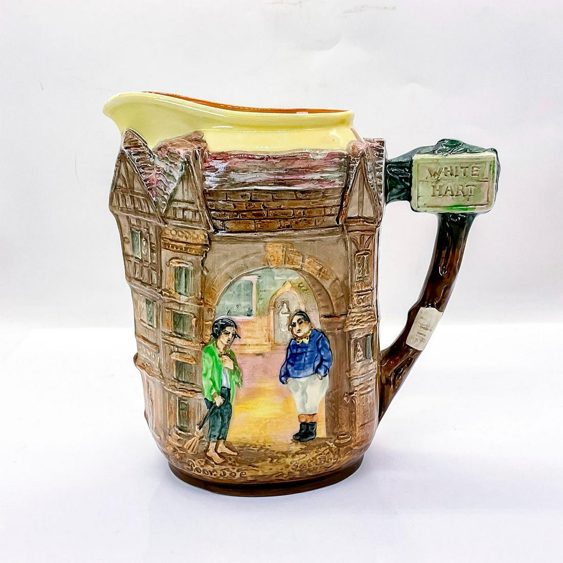Royal Doulton Dickens Pitcher, Fat Boy and Poor Jo: Characters from novels by Charles Dickens in low-relief. Fat Boy from The Pickwick Papers and Poor Jo from Bleak House. Royal Doulton backstamp. Issued: 1908-1975 Dimensions: 7.5"L x 4"W x 7.75"H Manu