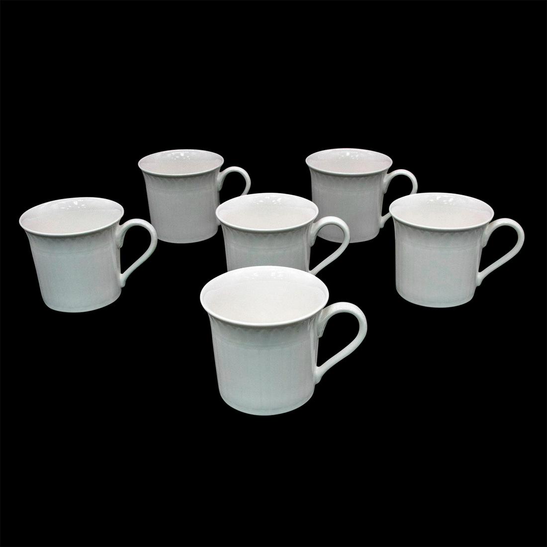 6pc Villeroy and Boch Coffee Cups, Cellini: White fine china tea/coffee cups; glossy finish, embossed rim. Villeroy & Boch backstamp. Comes with original box; size - 3.25"H x 11.25"W. Issued: 2001 Dimensions: 2.75" H Manufacturer: Villeroy & Bo