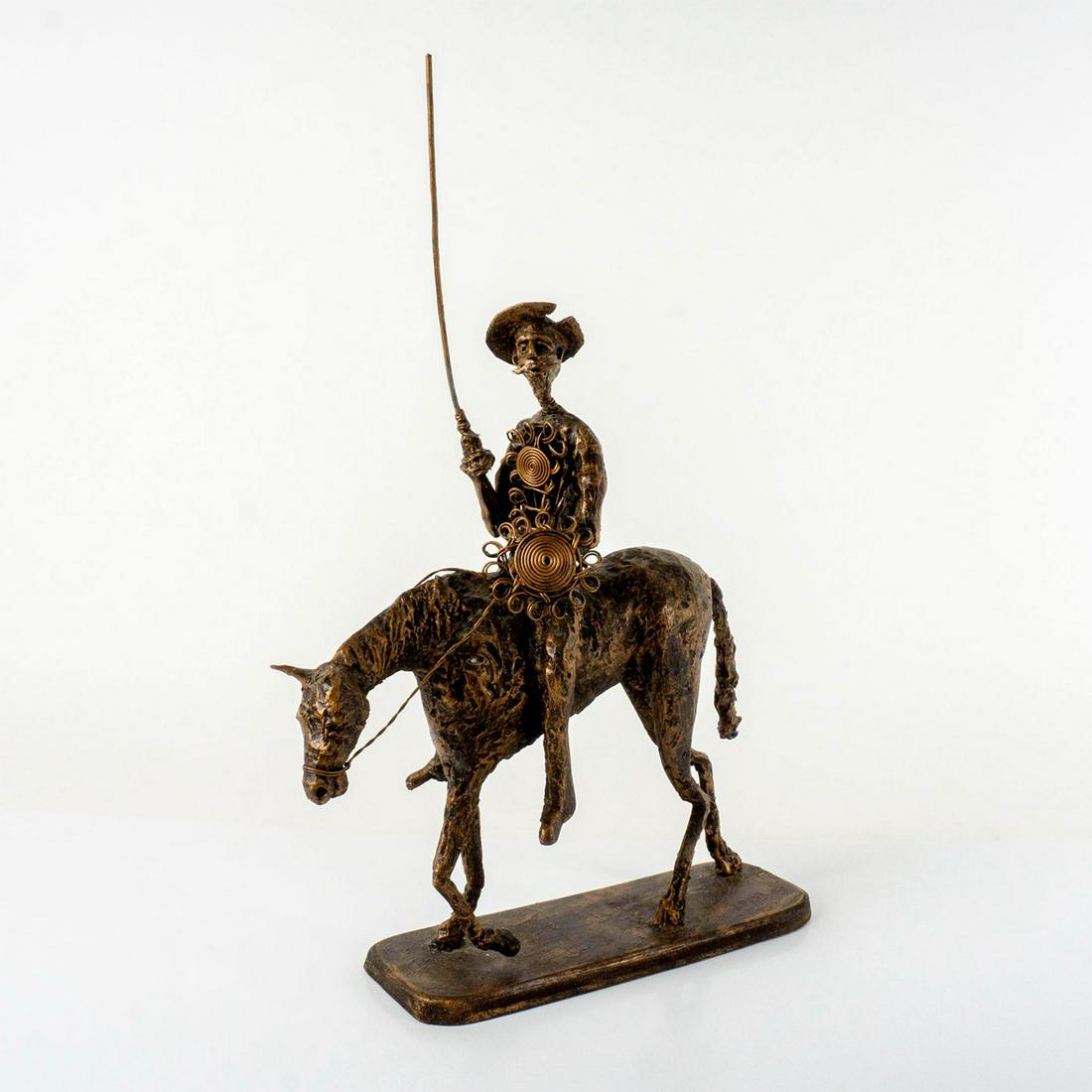 J. Pena, Wired Resin Sculpture, Don Quixote, Signed: Don Quixote figure sits atop his horse holding sword. Signed and dated to base.Â Honoring this gentleman going on quests to prove and challenge himself. He holds metal armor in left hand an